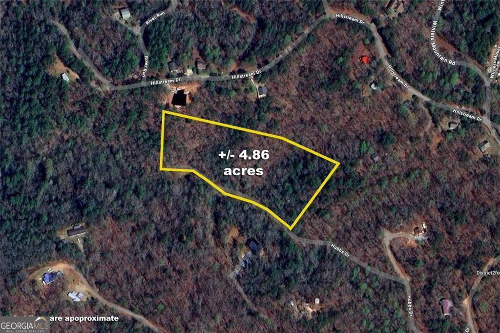 LOWEST PRICE PER ACRE LAND IN LUMPKIN COUNTY!!! UNRESTRICTED LAND! 15 minutes to DOWNTOWN DAHLONEGA and WINE COUNTRY! 4.86 +/- acres with roughed in driveway. Multiple possible house site locations. Road frontage is partially paved and partially gravel. 4WD recommended.