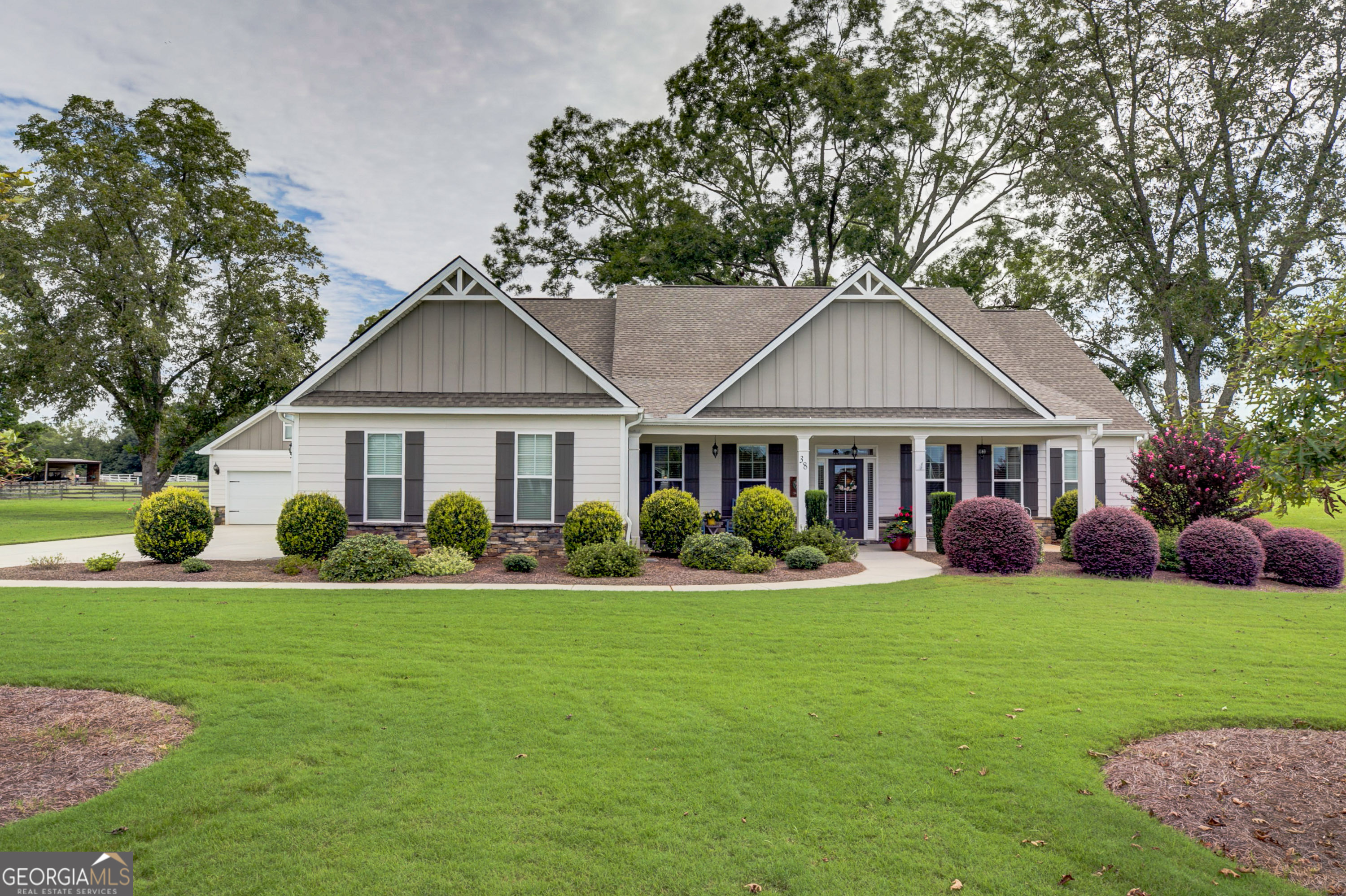 Beautifully maintained ranch in popular Chapman Farm Subdivision. Sitting on an acre lot, this home features 3 large bedrooms, 2 full baths and 1 half bath on the main level with a 4th large bedroom and full bath on the second level, perfect for guests. The main level offers an office or living room with double doors for privacy. The spacious dining room opens to the kitchen, which features stainless steel appliances and quartz counter tops. This is an all electric home with the exception of an added propane tank for the gas fire place. A large sunroom overlooks a beautifully manicures lawn with several large pecan trees. In addition to the attached 2 car garage, there is also a free standing 2 car garage with additional storage for lawn equipment.