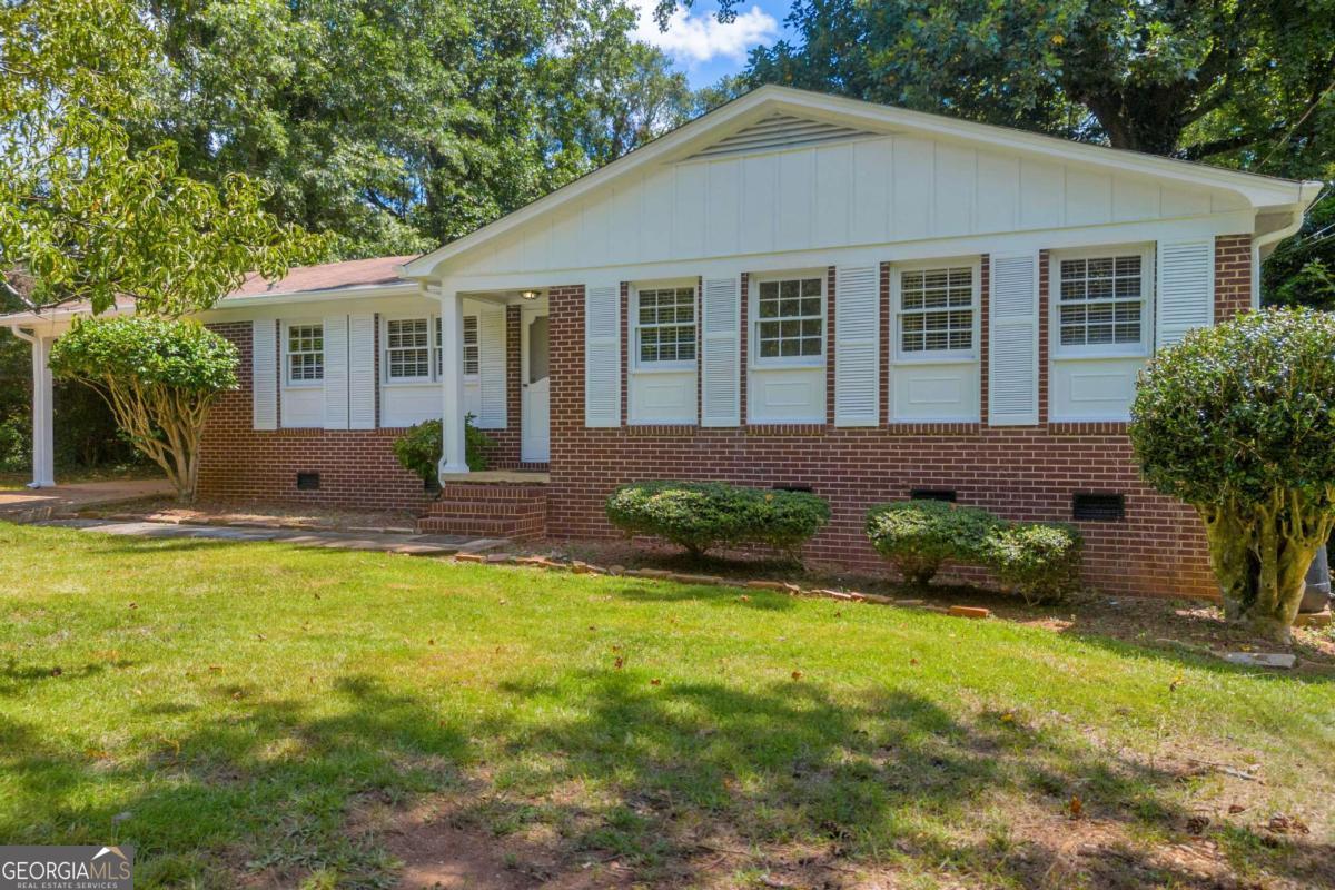 MULTIPLE OFFERS PLEASE SUBMIT HIGHEST AND BEST BY NOON 7-27. SELLER WILL MAKE A DECISION BY 7 PM. Prime location minutes from UGA Vet School, UGA main campus and downtown Athens. Four side brick ranch with hardwood floors and tile~no carpet and fenced back yard. Quaint and cute the home has fresh interior and exterior paint and is move in ready. Breakfast area features a banquette. The dining area or additional living area has built ins for storage and display opportunities, a brick fireplace and exposed wood beams. Both bathrooms are tiled. Roof is 8 years, Trane AC 11 years, Furnace 10 years, Tankless water heater 8 years, updated light fixtures, 2024 updated electrical as well as new dishwasher, garbage disposal, smoke detectors and carbon monoxide detector.