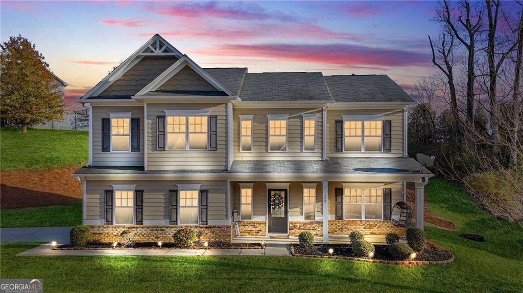 Lot survey attached. Seller offering $5,000 credit for fence configuration (or buyer's choice) since the fence does not configure to the entire lot. Introducing 200 Cherokee Reserve Circle, Canton, GA-a beautifully maintained home built in 2018, situated in a prime location near Northside Hospital Cherokee, Chart Industries, Inc., Pilgrim's Pride, Universal Alloy Corporation, and Ubique Group, and more! Nestled in a sought-after community offering a **pool, park, and more**, this home combines modern design with timeless elegance. Inside, you'll find a soaring **two-story foyer**, an **open-concept kitchen with granite countertops, a large island, stainless steel appliances, and a walk-in pantry**. **Hardwood floors, crown molding, and tray ceilings** add sophistication throughout. The **owner's suite features a spa-like bath with a garden tub, tiled shower, and walk-in closet.** The property features an **attached garage** for your convenience and a **private backyard oasis** with a covered patio-ideal for outdoor dining and relaxation. Whether hosting guests or enjoying quiet evenings, this home is designed to meet all your needs. Situated near **top-rated Cherokee County Schools**, this home offers proximity to shopping, dining, and entertainment options at **Riverstone Plaza and the Outlet Shoppes at Atlanta**. Outdoor enthusiasts will love the nearby **Etowah River Park and Blankets Creek Mountain Bike Trails**. With quick access to I-575, commuting is effortless. This exceptional property offers more than a home-it provides a lifestyle. Don't miss your chance to see 200 Cherokee Reserve Circle-schedule your showing today!