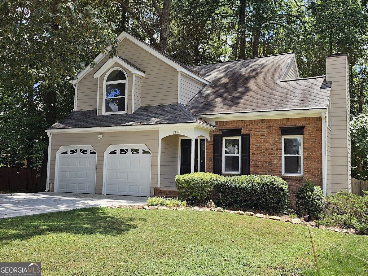 This move-in ready, 3 bedroom 2.5 bathroom home with attached two car garage and fenced backyard, located in cul de sac, is waiting for you! The main floor includes entrance foyer, family room with fireplace and vaulted ceiling, dining room with exit to an attached screened porch, kitchen with eating area, powder room and laundry room. Kitchen has near new appliances, stained cabinets and two pantries. The entire main floor has dark laminate flooring for easy maintenance and updated lighting. Upper floor includes the primary suite with walk-in closet and updated private bath with separate tub/shower. Two additional bedrooms share a full bath located in hallway. New water heater and garage doors installed in 2025. New concrete driveway installed on 2024. Hardi plank siding installed and painted in 2021. New HVAC installed in 2018. New roof installed in 2017. All kitchen appliances, washer and dryer remain with the home.