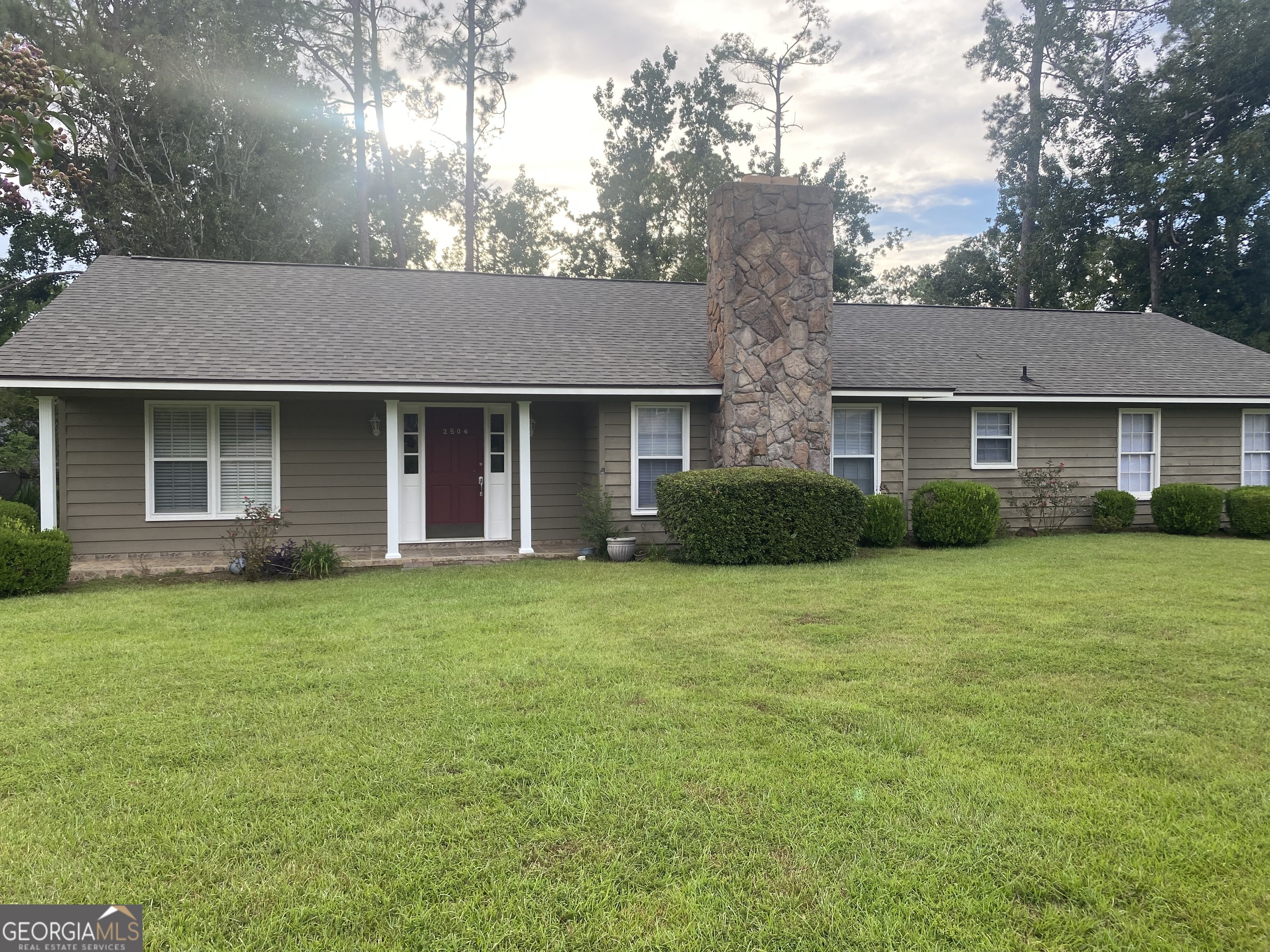 Well maintained cedar siding home in Old Wood Valley now vacant and move in ready! A great value, this property is located in the heart of Valdosta-close to EVERYTHING! Spacious floor plan featuring large FR w/built-in bar closet, stone fireplace w/gas logs and a "wall of windows" overlooking the pretty bricked patio, perfect for a grill and hosting friends and family! Formal dining room as well as breakfast area in kitchen. All appliances remain including double wall ovens and washer/dryer. Brand new rear fence, new roof in 2024 and offering a one year home warranty free to buyer. Wonderful family home that won't last long!