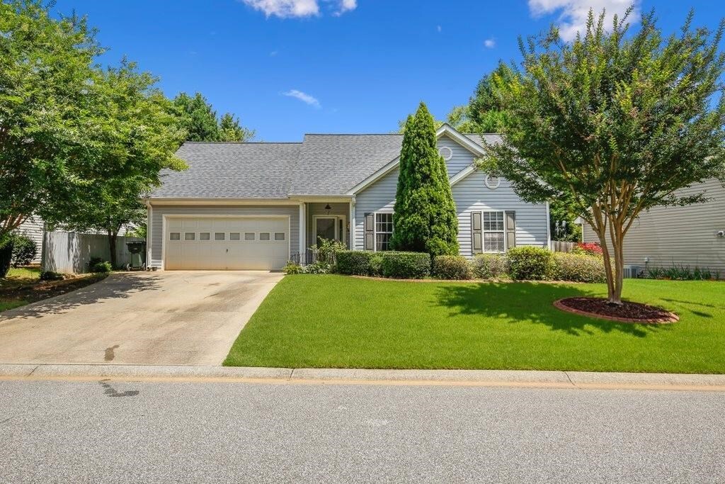 This ranch-style charmer is nestled in the sought-after community of Barrett Farms. This home has been lovingly maintained and offers a newer roof, water heater, and a 3 ton Trane HVAC system for worry-free maintenance. Step out to the fully fenced backyard just exploding with color and perfect for gardening, pets, and playsets! The garage has been professionally converted into additional living space with laminate flooring, for both beauty and durability and extra insulation for energy efficiency and low utility bills. Minutes from Barrett Park to enjoy walking trails, playground, and basketball court. Easy access to I-575 for a stress-free commute. No HOA!