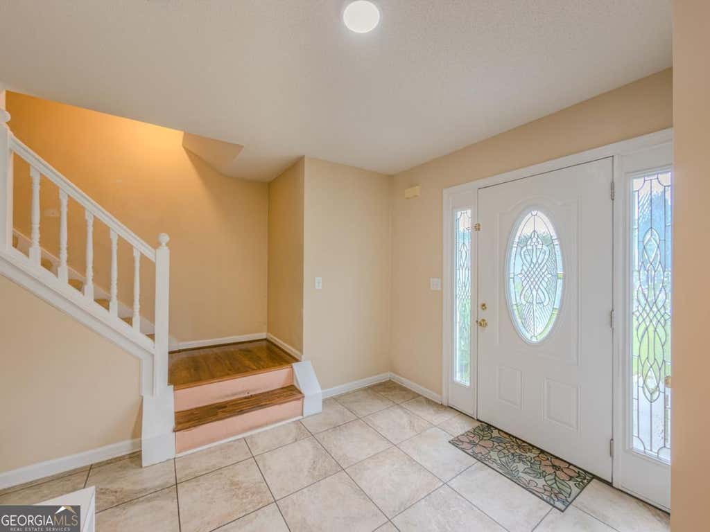 Photo of 6049 Hitt Lake Trail, Stone Mountain, GA 30087 (MLS # 10810659)
