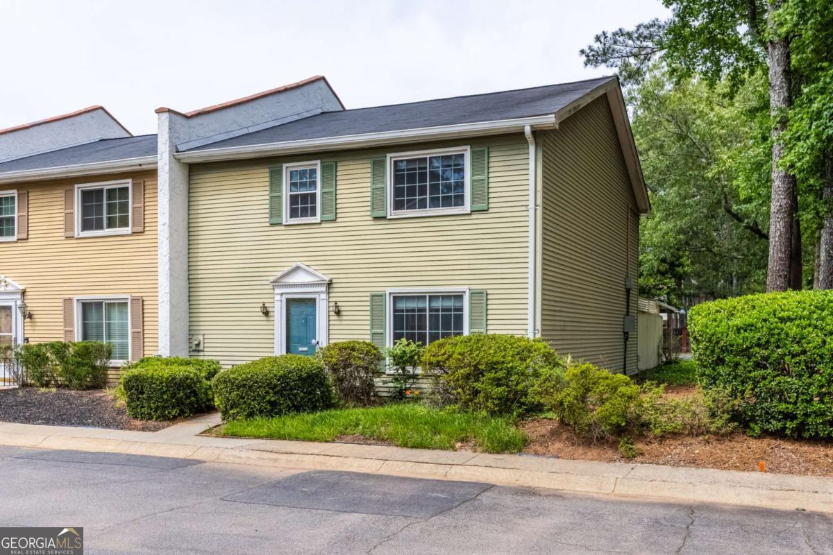 Charming 3BR Townhome in the Heart of Tucker! Welcome to 1701 Wiscasset Place - a spacious and beautifully maintained 3-bedroom townhome nestled in the quiet, sought-after community of Wiscassett Square. With nearly 1,900 square feet of living space, this move-in ready home offers the perfect blend of comfort, convenience, and value. Step inside to find generously sized living and dining areas, a separate family room, laundry and a bathroom on the main level. Upstairs, all three bedrooms feature brand-new carpet, including a spacious primary suite with a large walk-in closet. The secondary bedroom also boasts its own walk-in, perfect for extra storage or a home office setup. The private rear courtyard is perfect for morning coffee or evening relaxation, and the 2-car covered carport with extra storage adds convenience rarely found in townhome living. Located just minutes from shopping, dining, and major highways, this low-maintenance home also includes HOA-covered exterior maintenance (including roof), water, trash, and community pool access. Prime location with easy access to Downtown Tucker, I-285, and top-rated DeKalb schools.