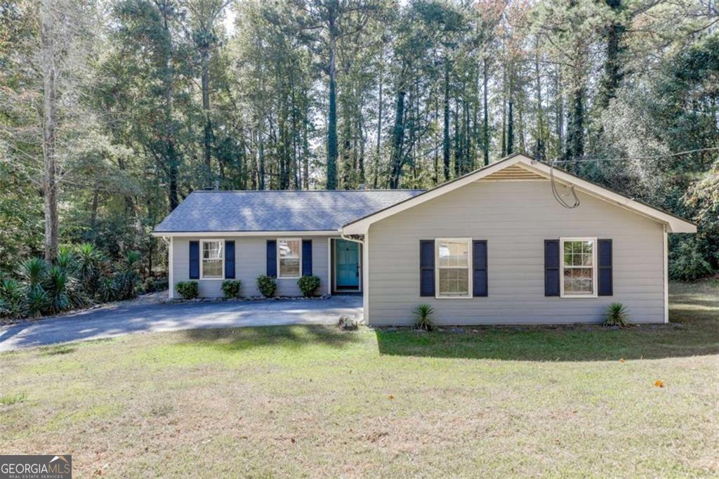 *Owner Financing Available* Welcome home to this beautifully maintained 3-bedroom, 2-bath ranch-style home, perfectly designed for comfortable living. This home features a functional single level layout, accompanied by an open living area centered around a classic brick fireplace. The kitchen has stainless steel appliances and ceiling fans offer year-round comfort. Additional features include a backyard shed and a generous yard with plenty of space to enjoy. The Exchange at Gwinnett is right around the corner and is filled with dining and entertainment options, including Andretti Indoor Karting, Top Golf, Pickle and Social, and much more. Don't miss this move-in-ready gem-schedule your showing today.