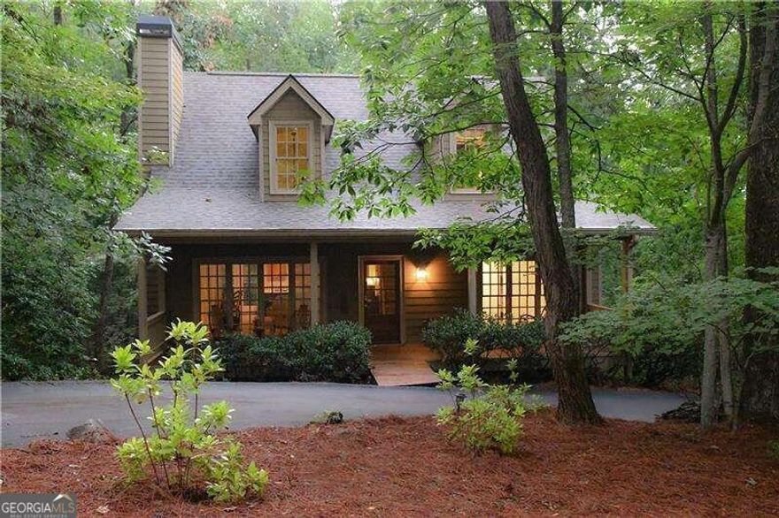 Newly renovated 4 B/R -3 Bath design home with open floorplan and seasonal mountain views. High volume ceilings, hardwood flooring and Master B/R suite with crown molding, separate soaking tub and shower and laundry area is located on the main level. Open kitchen with separate dining area has T&G wood ceilings, wood cabinets, work island with gas cooktop, breakfast bar and updated appliances. Upstairs includes 2 b/r's with one oversize shared full bathroom, and on the terrace level is an expansive family room, a 4th b/r suite with full bath access and storage room with outdoor access. Updates include brand new roof and exterior doors replaced, front and back wood decks restained, and interior repainted, all in 2023. Hvac system with whole house dehumidifier installed, water heater and refrigerator replaced in 2021-2022, and the exterior was just recently power washed. This very charming and centrally located home has a desirable level circular driveway and adequate space for carport or two car garage if so desired which has been approved by the AECD. The subject property is adjacent to green space on two sides for added privacy ,and enjoys quick and easy access to the Amenities and Main Gate. An outstanding value and a must see!