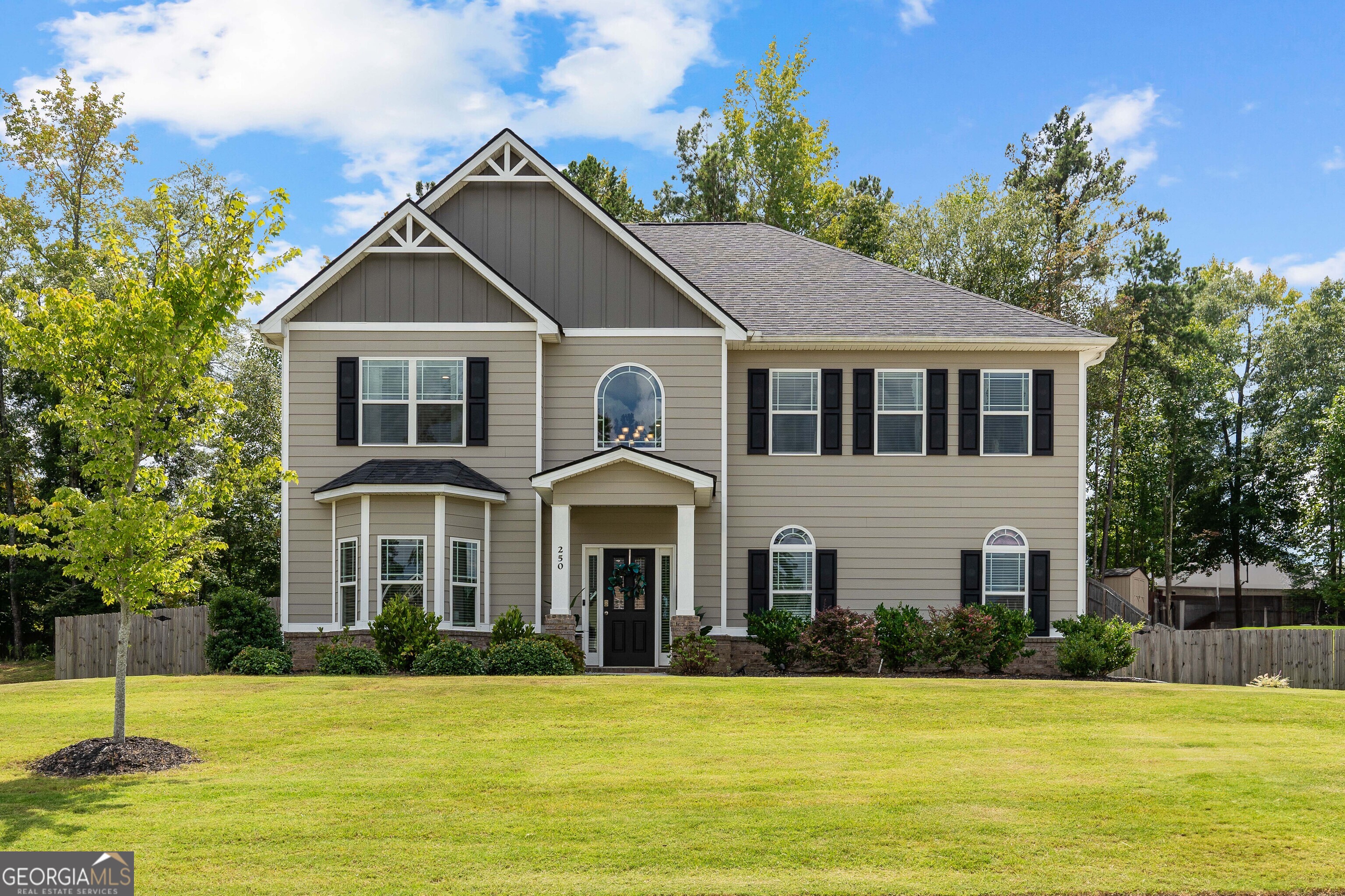Welcome to 250 Calebee Avenue - Stylish, Spacious & Exceptionally Maintained in Senoia's Sought-After Heritage Pointe. This stunning 4-bedroom, 2.5-bath Abigail floor plan home offers 3,497 sq ft of refined living space and was built in 2021 with modern comfort and style in mind. Step inside to an open-concept main level featuring engineered hardwood floors, a bright and airy chef's kitchen with granite countertops, a large island with bar seating, and a dedicated formal dining room-perfect for hosting. Relax in the cozy living room beside the gas fireplace, and enjoy seamless indoor-outdoor flow to the beautifully landscaped, fenced-in backyard and inviting patio. This home is move-in ready with fresh interior paint and an array of smart home features, including app-controlled garage access, 220V EV charging, a Bluetooth-enabled stove, and a WiFi thermostat. Upstairs, retreat to the luxurious primary suite, complete with a spa-inspired bath and an expansive walk-in closet. Three additional bedrooms provide plenty of space for family or guests, including a convenient Jack-and-Jill bathroom connecting two of the rooms. Neighborhood & Lifestyle: Located just a golf cart ride away from charming and historic downtown Senoia and a short drive to Peachtree City's plentiful conveniences. Situated in a welcoming, walkable, and family-oriented community, Heritage Pointe offers outstanding amenities such as a clubhouse, pool, tennis courts, and playground.