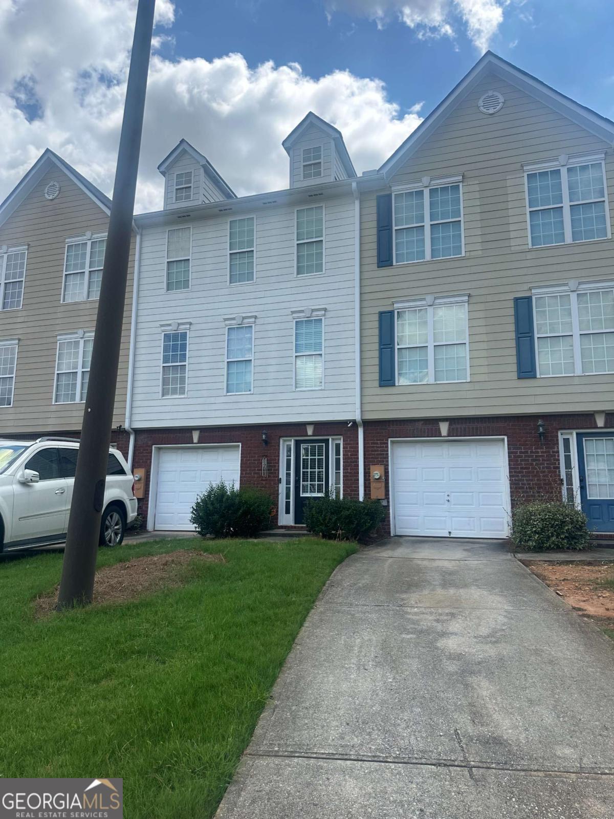 Welcome home to this beautifully maintained 3-story townhome in the Redan Square community! Enjoy an open-concept main level with a spacious living area, bright kitchen with island, and cozy breakfast nook - perfect for entertaining. Retreat upstairs to the oversized owner's suite with vaulted ceilings, a large walk-in closet, and soaking tub. The secondary bedroom also features an ensuite bath and vaulted ceilings. The lower-level bonus room offers flexibility for a home office, media room, or guest space. Conveniently located near shopping, dining, and major highways. No rental restrictions - great for homeowners and investors alike!
