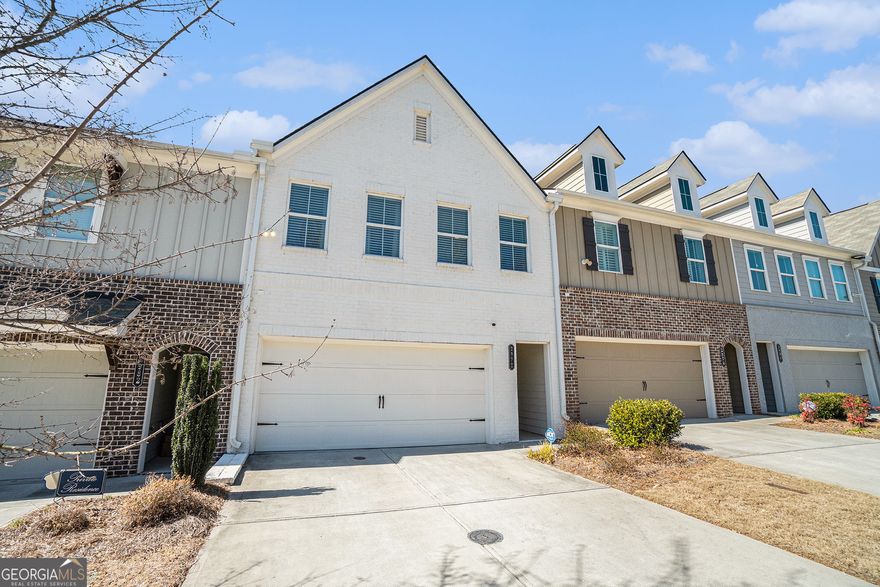 The seller is Motivated and open to contributing to the buyer's closing costs for this Stunning townhome that offers the perfect blend of modern luxury, convenience, and community living. This spacious 3 bedrooms 2.5 baths townhome was built 5 years ago, and meticulously maintained. This home boasts upscale features and an open-concept floor plan ideal for entertaining and everyday living. The spacious gourmet kitchen, equipped with top-of-the-line Whirlpool stainless steel appliances, quartz countertops, Walk-in pantry, tile backsplash, and a large island, is the heart of this home. Flow seamlessly into the dining area and family room, complete with a cozy fireplace, elegant LVP flooring, and remote-controlled automated blinds that allows more privacy and additional natural light to flow through. The generous owner's suite features dual vanities, a huge stand-up shower, nice size walk-in closet, and a sitting area. Also, from your owner's suite you have a view of the Kennesaw Mountain National Park! Two additional bedrooms provide flexibility for guests, home offices, or hobbies. Enjoy the convenience of a two-car garage, ample storage throughout, energy-efficient windows, storm door, ceiling fan in every room and security cameras are all features that make this home as practical as it is beautiful. Outside, a private patio offers space for grilling or relaxing with friends and family. The low-maintenance lifestyle allows you to spend more time enjoying everything that the City of Marietta has to offer, With award-winning restaurants, boutique shops, farmers' markets, and community events just a short stroll away, in addition, located less than 20 minutes away from the Marietta Square Market, Silver Comet Trail, The Battery of Atlanta, and Truist Park. This townhome truly combines the best of luxury and location!