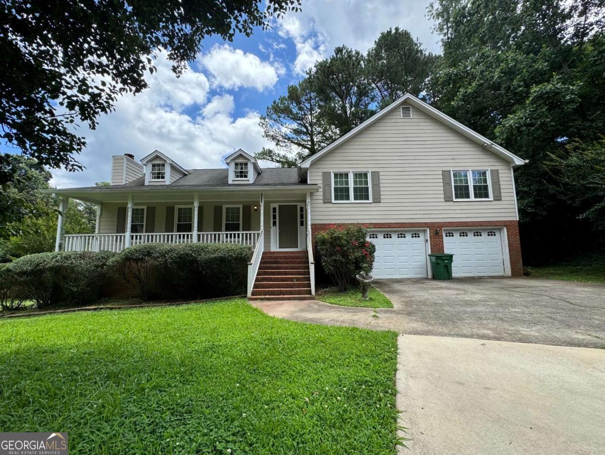 Make a great deal even better with massive savings through special loan programs with the Preferred Lender Envoy Mortgage with Aubrey Wilcox! Ask the Listing Team for the introduction for up to 100% Financing or even interest rates in the 4s! Welcome to 2936 Highland Park Drive-a spacious and inviting split-level home nestled in the established Carriage Park community of Stone Mountain. With 3 bedrooms, 2.5 bathrooms, and a finished basement, this home offers flexible living space perfect for everyday comfort or entertaining guests. Enjoy cozy evenings by the fireplace, relax on the open front porch, or host summer barbecues on the large back deck overlooking a private, wooded backyard on over half an acre. Living in Stone Mountain means being close to one of Georgia's most beloved landmarks-Stone Mountain Park-offering hiking trails, scenic views, lakes, festivals, and year-round recreational activities. The area also provides convenient access to shopping, dining, and local parks, plus major highways like I-285 and US-78 for easy commuting. Whether you're seeking outdoor adventure, everyday convenience, or a peaceful place to call home, this location has it all. Don't miss this opportunity to own a lifestyle home in one of Gwinnett County's most accessible and nature-rich communities!