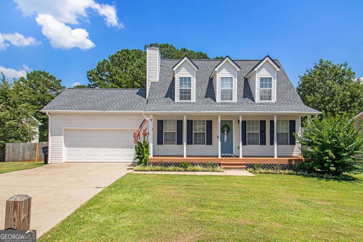 Charming cape cod home offers a LARGE FULLY FENCED BACK YARD and a FULL UNFINISHED BASEMENT -plus it's a quick commute to Atlanta, Newnan, or LaGrange and Columbus since it's only 3 MILES FROM I-85. This 3 bedroom 2 bath home has fantastic curb appeal with a Southern Living front porch and a huge fenced back yard. You'll love the convenience of having the master suite on the main level, plus the eat in kitchen which now includes a pantry, thanks to some clever updates made by the Sellers. The family room has a nice fireplace with a traditional hearth and mantle, and upstairs are 2 secondary bedrooms and a bath. 2 car attached garage. FULL UNFINISHED BASEMENT gives you all kinds of extra storage and gives you options to grow into the space over time. Come take a look!
