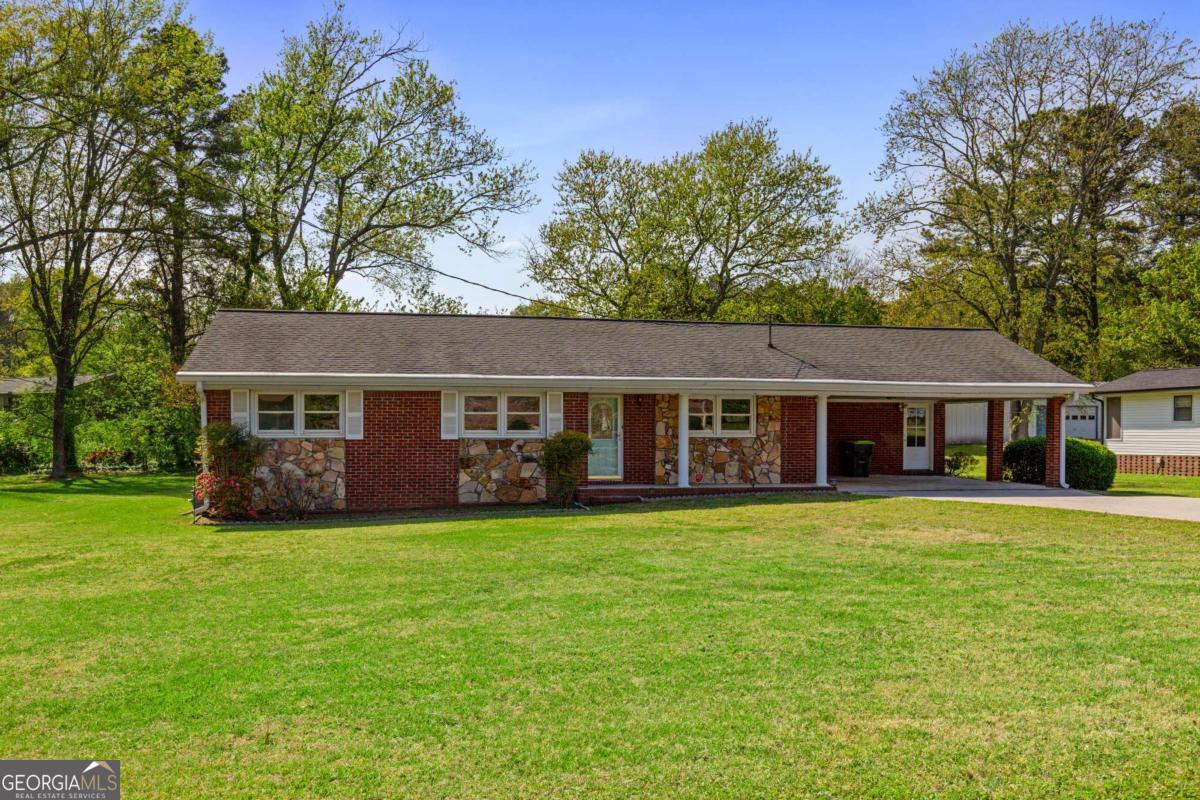 Step into a fully renovated brick ranch where charm, comfort, and convenience come together effortlessly. From the moment you walk in, you'll notice the fresh finishes, natural light, and the kind of thoughtful updates that make everyday living easy. The completely updated kitchen features clean white cabinetry, new stainless steel appliances, quartz counters, and a timeless backsplash - perfect for casual meals or weekend baking marathons. The open dining and living spaces flow seamlessly, offering room to gather or relax. The primary suite offers a quiet retreat with a newly renovated bathroom and modern, neutral tones. Two additional bedrooms plus a hall bath make space for guests, kids, or a home office. And yes - the laundry room has a view of the backyard, because even chores should come with a little sunshine. Outside, enjoy a large, flat yard and a screened porch that invites slow mornings and breezy afternoons. With new flooring throughout, updated bathrooms, fresh paint, and no rental restrictions, all the heavy lifting has been done. Looking for a cash-flow opportunity? The current tenant is excellent and willing to stay long-term if the buyer wishes to keep him - making this a great option for investors, too. Located in a quiet, established East Cobb neighborhood just minutes from Home Depot, grocery stores, gyms, schools, restaurants, hospitals, and major highways, this move-in ready home is a rare find. Whether you're starting out, downsizing, or investing, it's the kind of place that just feels right.