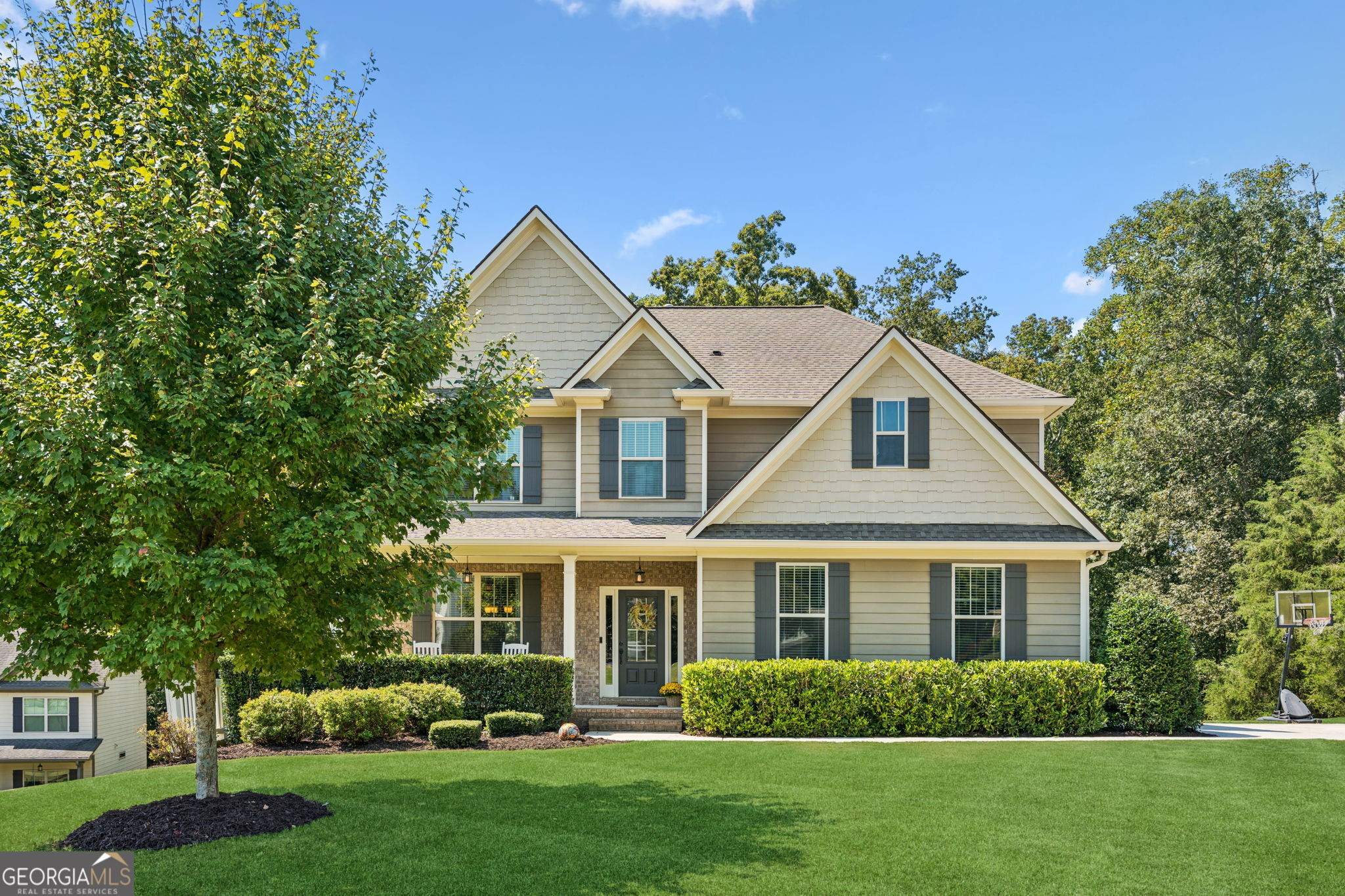 Prime location in the coveted East Forsyth established neighborhood, Sagewood! This gem is move-in ready and features 5BR/4.5BA on a beautiful .62 acre lot. The open floor plan is so spacious! Kitchen features a huge island with granite countertops, stainless steel appliances, a Walk-in pantry, AND the refrigerator stays too! The Family Room features a cozy fireplace and overlooks the Kitchen. Walk out to a large deck that overlooks a private backyard. Upstairs features a large Master Suite & Retreat with a large Walk-in Closet. Master Bathroom features a tile shower and a separate garden tub. Fully finished Daylight Basement boasts a Bedroom, Full Bathroom, and lots of Family Room to PLAY in. Walk out to private back yard oasis + more covered space under deck. Don't miss the Neighborhood amenities: Swimming Pool & Playground for the kids to enjoy. For outdoor and lake enthusiasts, Long Hollow Park, which includes a beach, boat ramp, and picnic area, is just a few minutes away. The top-rated Port Royale Marina and Pelican Pete's Bar and Grill are also nearby. Excellent award-winning Forsyth County Schools. #HeadEast Book your own personal tour today!