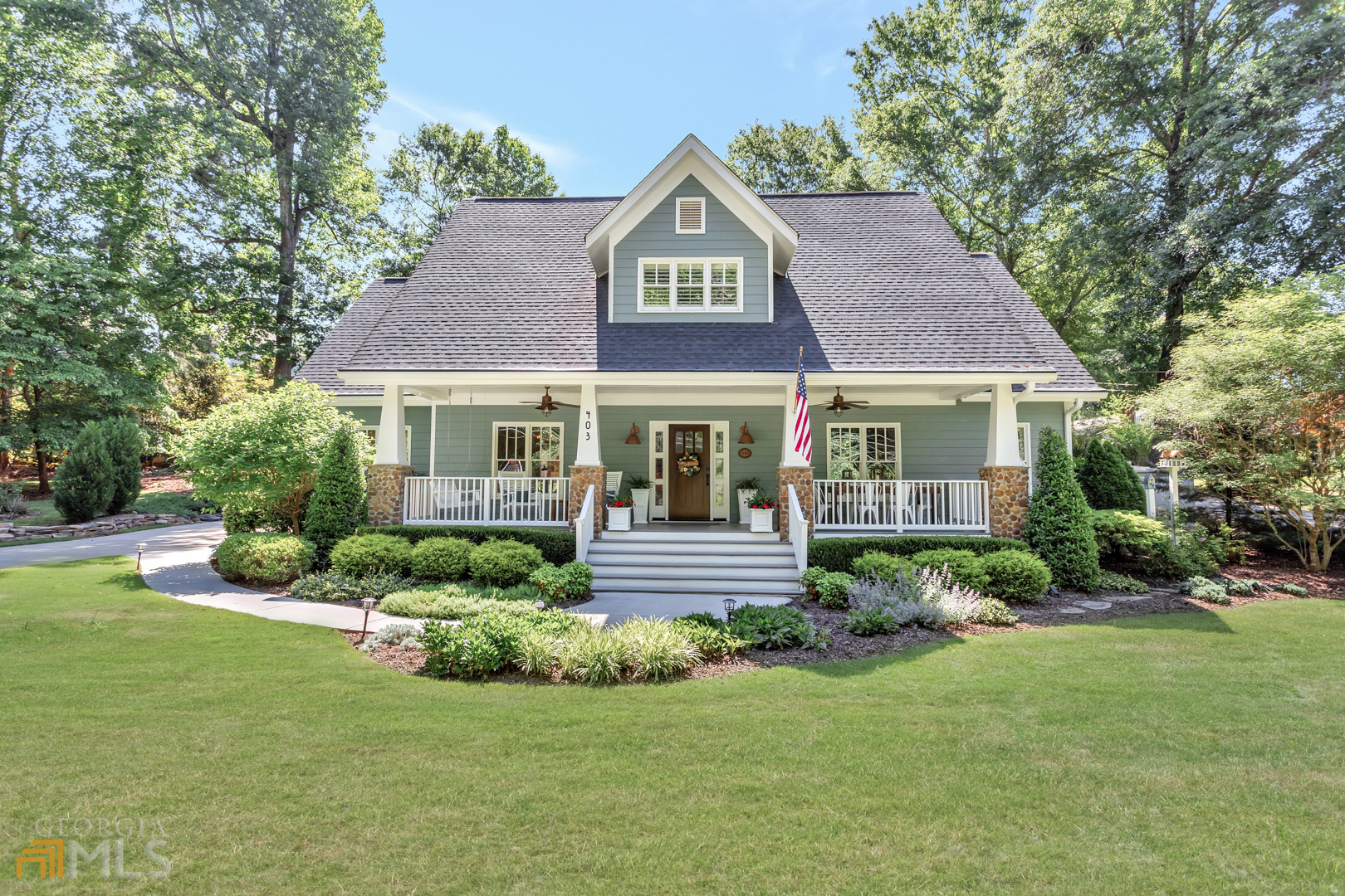 Craftsman Stunner in the HEART of Roswell. Completely upgraded with the finest finishes; this sweet home blends modern style with old world charm! Sip Sweet Tea in your rocking chairs and enjoy the cool breeze on the massive front porch overlooking the professionally landscaped front yard. Once inside, you're welcomed by gorgeous hardwoods that run throughout the entire home. Designer features such as on-trend paint colors, board and batton and crown molding provide an elegant feel. Just inside the front door, the home office features a brick fireplace, built-ins and views out to the front porch. Who wouldn't want to go to work here? A formal dining room leads to spacious, light-filled family room...don't forget to look UP at the shiplapped coffered ceilings! The kitchen was masterfully designed, featuring stainless appliances, old-world gas stove, double ovens, stone counters, massive pennisula for food prep, wine fridge and the perfect breakfast banquette for casual meals. A convenient guest room with ensuite bath could easily pass for a second primary bedroom on the main level. Boasting subway tile, double vanitiers and large soaking tub and brick accents, your guests may never want to leave! Head up the grand staircase and find two additional guest rooms each with a unique style and roofline providing anything but an ordinary look and feel. A second, well designed bathroom serves those bedrooms. The upstairs primary bedroom offers a lovely seating area and HUGE ensuite with another soaking tub, double vanities and shower. Enjoy al fesco meals on the back flagstone patio under the twinkling lights. A sweet swing invites you to daydream under the pergola amoungst the flowers. This home is one of a kind and should NOT be missed.