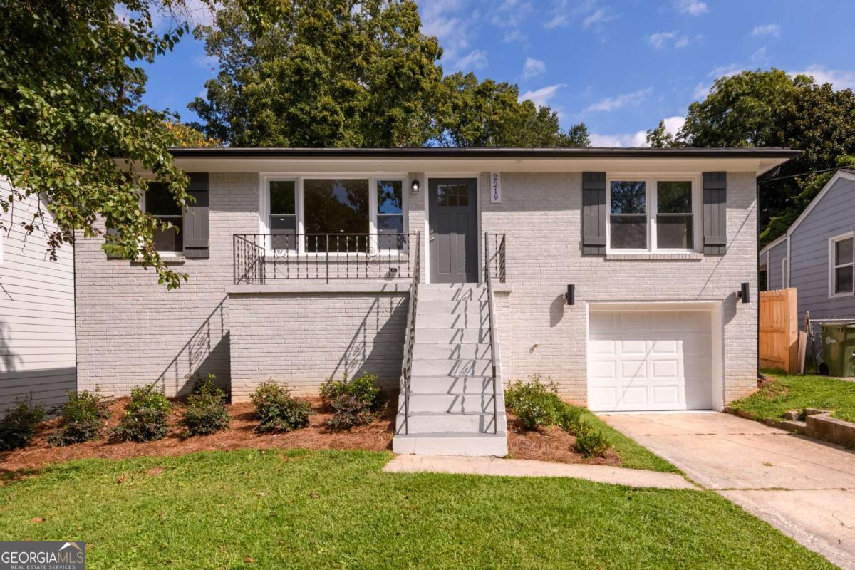 Transformation completed! Wow. Designer colors, come home to STYLE! Classic Atlanta Ranch, walk into new flooring, paint, plumbing, electrical, Tankless water heater, large island, new windows, 2 bedrooms, hall bathroom, master with master suite, updated kitchen with island, farm sink, gas range, microwave, lovely lot with a deck overlooking your own private backyard! Don't wait. It's all been done for you. One car drive under garage with plenty of flexible space left over to use for a hobby or dry storage. Opportunity knocks...