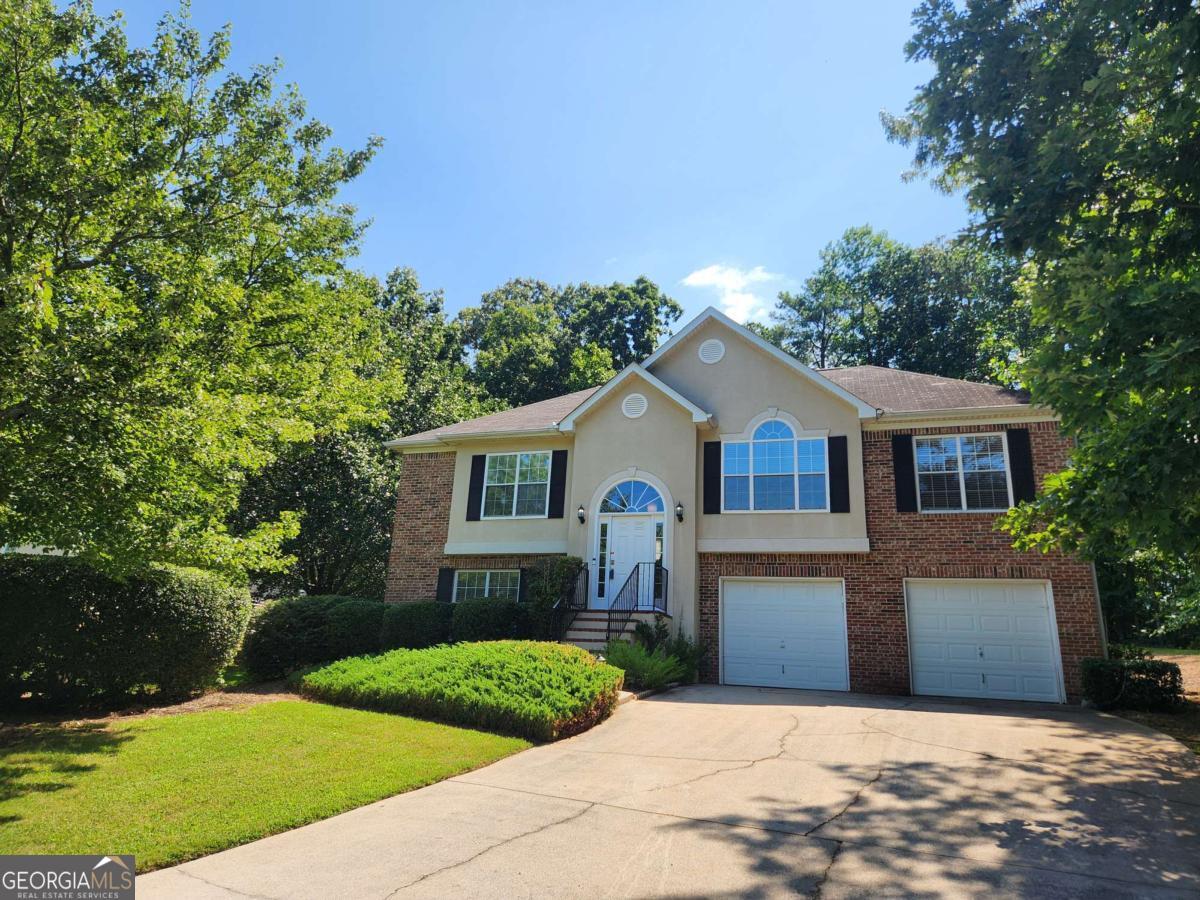 Priced to Sell! 4BD/3BA Cobb County gem. Minutes from Atlanta, Truist Park, & Silver Comet Trail. Open-concept living w/ fireplace, master suite with double vanity, separate soaking tub and shower, & new large deck. New flooring on the main level and a new retaining wall in the back. Perfect for your updates! Tour today!