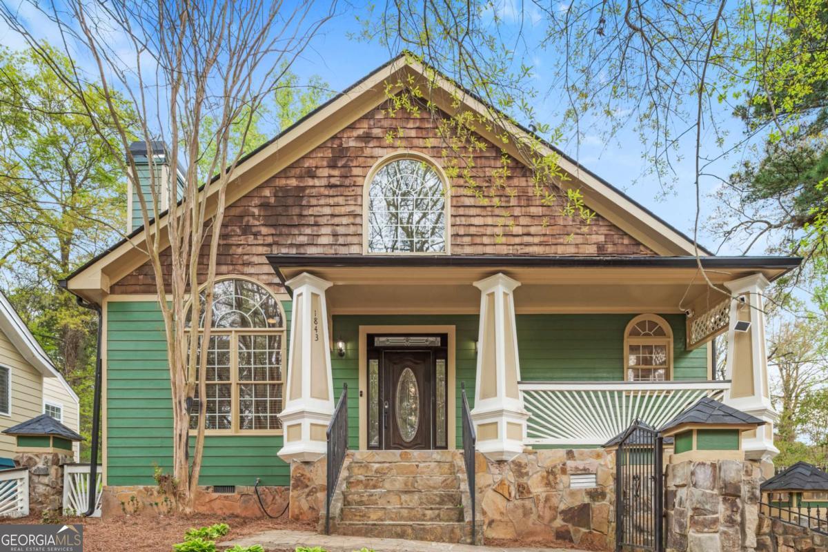 Two renovated homes for the price of one!!! Exceptional rare investment opportunity in this one of a kind home with a detached two-story guesthouse in the booming Upper Westside neighborhood of Grove Park in the heart of Atlanta. As you enter the main house you're greeted with the light-filled foyer that extends to the spacious hallway. On the left is the spacious living room that offers plenty of room for both relaxation and entertaining. At the heart of the room is a stunning fireplace designed to add a touch of elegance and warmth. The skylights allow natural lighting to flood in highlighting the room's features and creating a bright, welcoming atmosphere. It's the perfect spot for gatherings or quiet movie nights. Across from the living room you'll find a stunning eat-in, gourment kitchen featuring granite countertops and stainless steel appliances that offer both style and functionality. The beautiful island is perfect for meal prep or casual gatherings. This kitchen is designed to be the perfect hub for family and friends to come together. The primary bedroom is also on the main level and offers a luxurious retreat with a fireplace and spa-like bathroom while the additional bedrooms provides flexible options for guests, home offices, or hobbies. The partial basement is finished with full bathroom and oversized bedroom which can easily be a theater or recreational room. The climate-controlled sunroom is perfect for enjoying morning coffee or relaxing in the evenings. Step outside the sunroom and into the serene and luxurious guesthouse that features 3 bedrooms and 2 full bathrooms. The living room opens to the kitchen which features granite countertops and stainless steel appliances. The primary bedroom is on the main level while the other two bedrooms are upstairs where you'll find a private balcony perfect for watching the sunrise and sunset. Both houses have tons of upgrades including tiled showers, LVP flooring throughout, and much more! Minutes from downtown, Westside Park, and Beltline West Side. This property is perfect for renting, multigenerational living, or live in one and rent the other. The possibilities are endless! Both homes are currently generating excellent income on Airbnb.