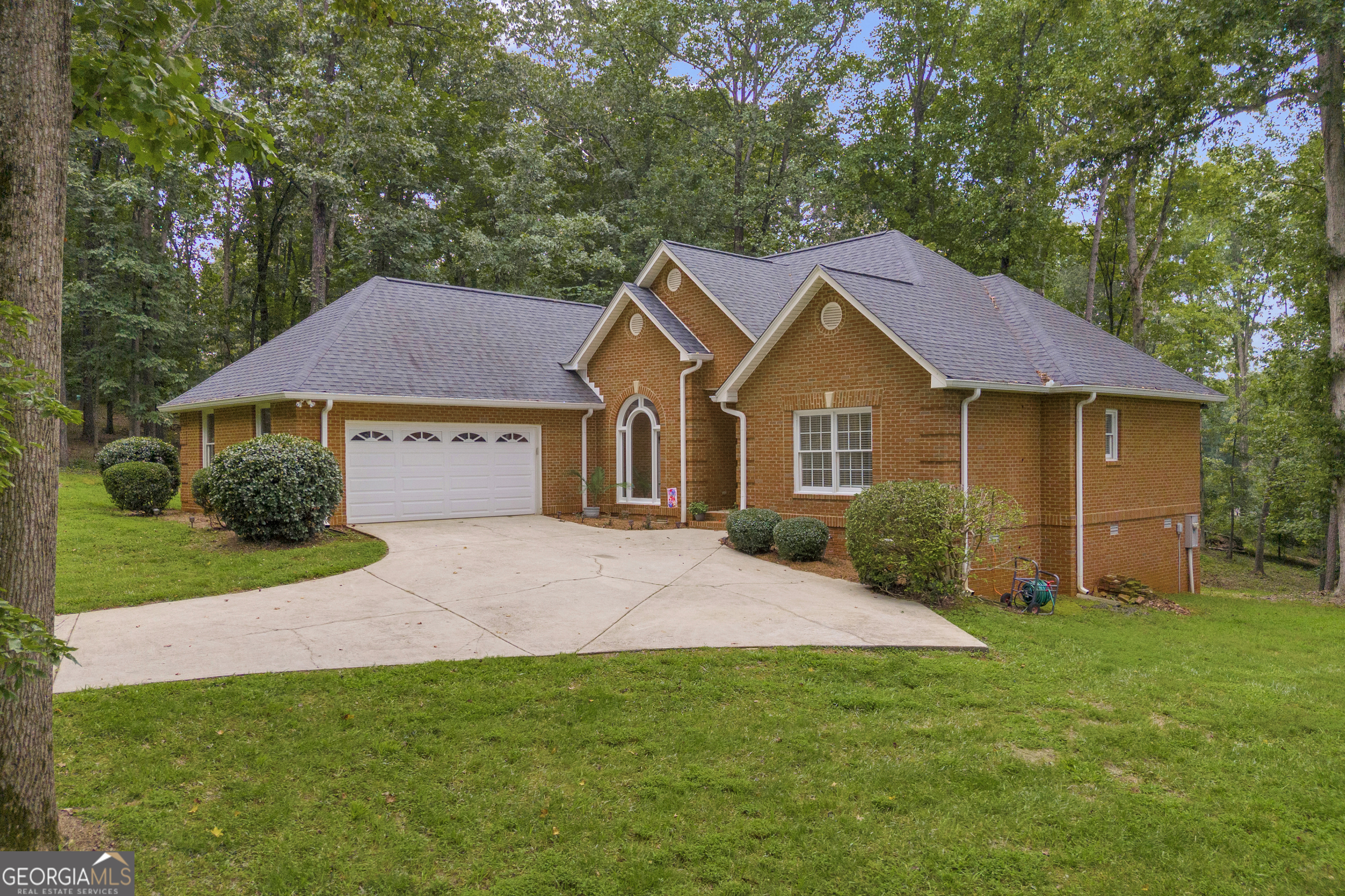 Experience the perfect blend of classic elegance and modern comfort in this spacious 3-sided brick home, ideally situated on an expansive 2 acre wooded lot in a mature, established neighborhood. This 3 bedroom 2.5 bath generous layout provides ample space for comfortable living, while the private backyard offers a serene retreat. The garden shed is perfect for storage, yard equipment or the inspiring hobbyist. Shed is complete with water and a mini- a/c unit. Enjoy the benefits of a well-regarded community, with nearby parks, shops, and convenient access to major thoroughfares.