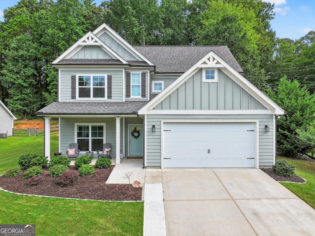 ***OPEN HOUSES: Sunday, 9/7, from 2:00-4:00pm.***Welcome to your new home in Dawsonville! Just minutes from Lake Lanier, this beautiful 3-bedroom, 2.5-bath home sits on over half an acre, offering the perfect mix of space, comfort, and location. A charming covered front porch sets the tone-perfect for sipping morning coffee or unwinding after a long day. Step inside and you'll find a bright formal dining room off the foyer. The heart of the home is the spacious living room with a cozy fireplace, which flows seamlessly into the breakfast area and dream kitchen. Featuring a large island with breakfast bar, abundant cabinets, and generous counter space, this kitchen is as functional as it is stylish. A convenient half bath completes the main floor. Upstairs, the primary suite is a true retreat with tray ceilings, a huge walk-in closet, and a spa-like bathroom complete with a soaking tub, separate shower, and double vanities. Two additional bedrooms with large closets share a full hall bath. The laundry room upstairs makes everyday living a breeze.Step outside to a covered back patio-perfect for grilling, relaxing, or entertaining-plus a backyard storage shed for all your tools and toys. With its prime location close to the lake, this home offers the best of Dawsonville living. Don't miss your chance to make it yours!