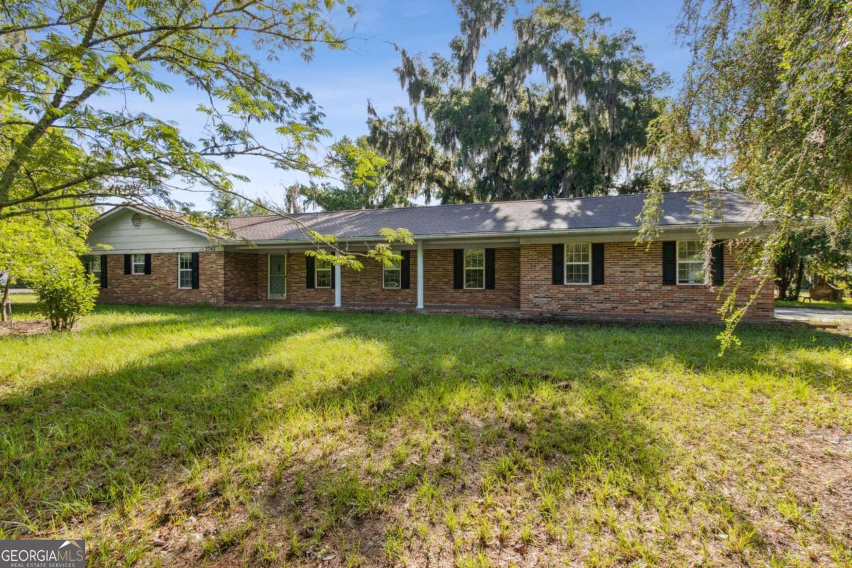 Versatile opportunity on US Highway 1! This traditional brick ranch at sits on 1 acre and has been used as a residence, but is also well-suited for commercial use. The sale includes an additional parcel, giving you a total of 2.6 acres with approximately 1,000 feet of frontage on busy US 1-perfect for visibility and access. Inside you'll find large rooms filled with natural light, a newer roof, and the classic charm of a custom-built home. With a little vision and sweat equity, this could become your ideal home, business location, or both. Whether you're looking to restore, repurpose, or reimagine, this property offers a rare blend of character, space, and prime location.