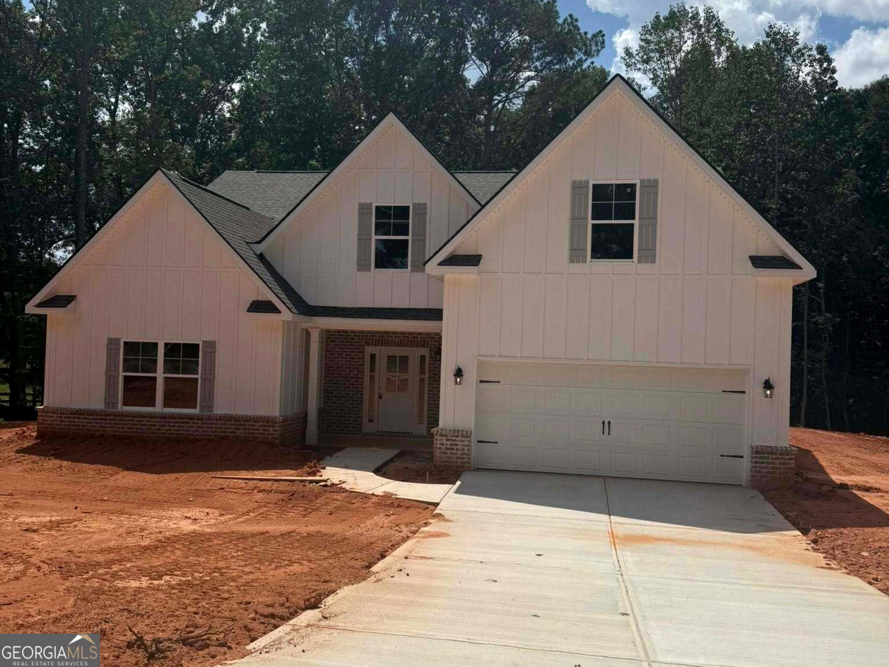 Experience peaceful living in this brand-new 4-bedroom, 3-bath ranch-style home nestled on 2.02 acres in beautiful Jackson County. With 2,842 square feet of open-concept living, this thoughtfully designed home features a spacious front and backyard, professional landscaping, and a wooded backdrop for added privacy. Enjoy a light-filled open floorplan with the primary suite conveniently located on the main level, complete with oversized walk-in closets and a beautifully tiled master bath. Laundry room on main. Modern finishes, generous living spaces, and a seamless indoor-outdoor flow make this home perfect for both everyday comfort and entertaining. Move-in ready and built for easy living-your dream home awaits. *Professional photos will be uploaded Friday*