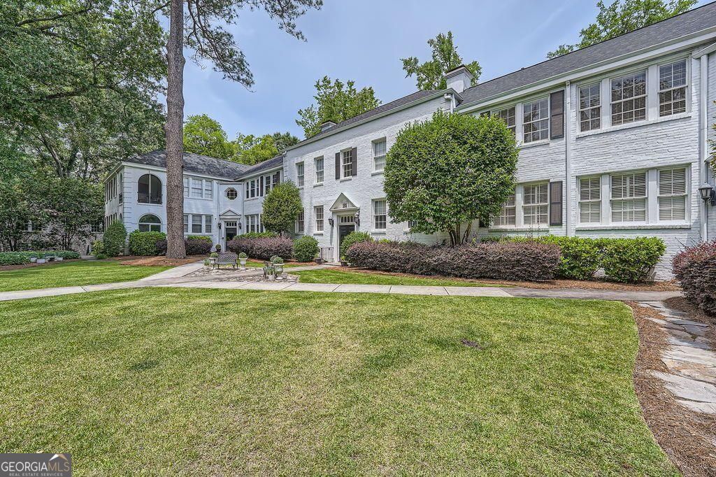 Welcome to Unit 6 at 21 Peachtree Memorial Drive - a beautifully maintained top-floor 1-bedroom, 1-bathroom condo nestled in a serene, tree-lined community in the heart of South Buckhead. This light-filled home features fresh paint throughout, gleaming hardwood floors, oversized windows, high ceilings, and classic architectural details. The spacious living area flows seamlessly into a separate dining room, perfect for entertaining or remote work. The kitchen offers ample cabinet space, gas cooking, and a large window overlooking lush greenery. Enjoy a generously sized bedroom with dual closets and a vintage-tiled bathroom filled with natural light. Located just minutes from the Atlanta BeltLine, Piedmont Hospital, Peachtree Battle Shopping Center, and some of the city's top dining and retail, this unbeatable location provides easy access to Midtown, Buckhead, and Downtown. Enjoy the charm of a boutique building with secure entry, manicured landscaping, and easy parking.