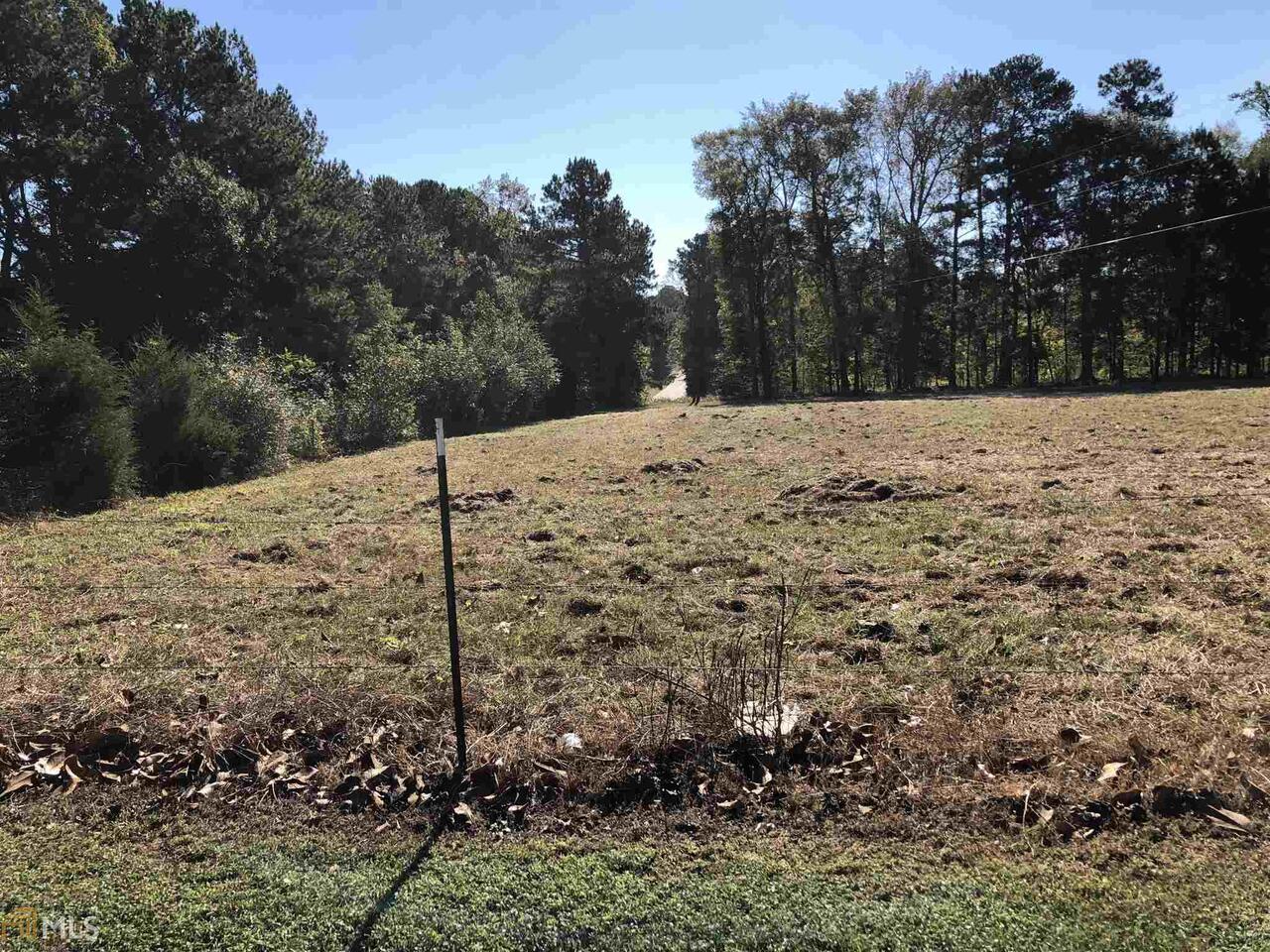 Beautiful 5 acres, mostly pasture with some woods. Just south of historic Madison with easy access to shops, schools, I-20. Zoned AG. Priced Right! A Must See Aerial Picture depicts an approximate 5 Acre Land portion of Parcel # 061 061 and portion of #061 046A