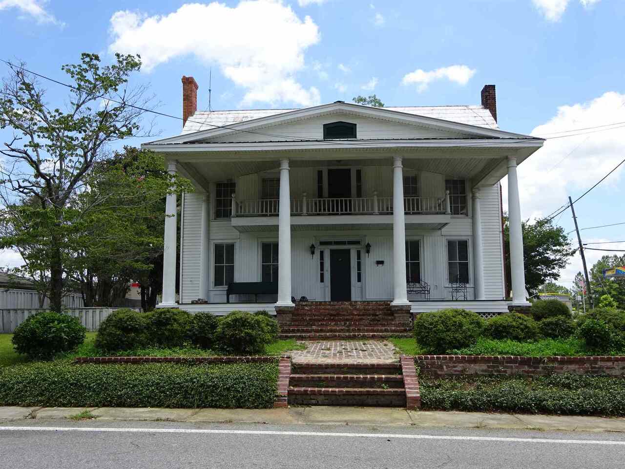 Come see this home built circa 1890 and well maintained. The home has vinyl siding for ease of maintenance. There are 2 bedrooms down stairs with 2 full baths and 2 bedrooms upstairs with 1 full bath. There is a combination of hardwood floors and carpeting in the home. The large dining room/den combination will host all family and friends and the separate living room in the front of the home has a fireplace. There are two central heat and air units. Many windows have been replaced. Call Audrey for a showing (912) 739-0044