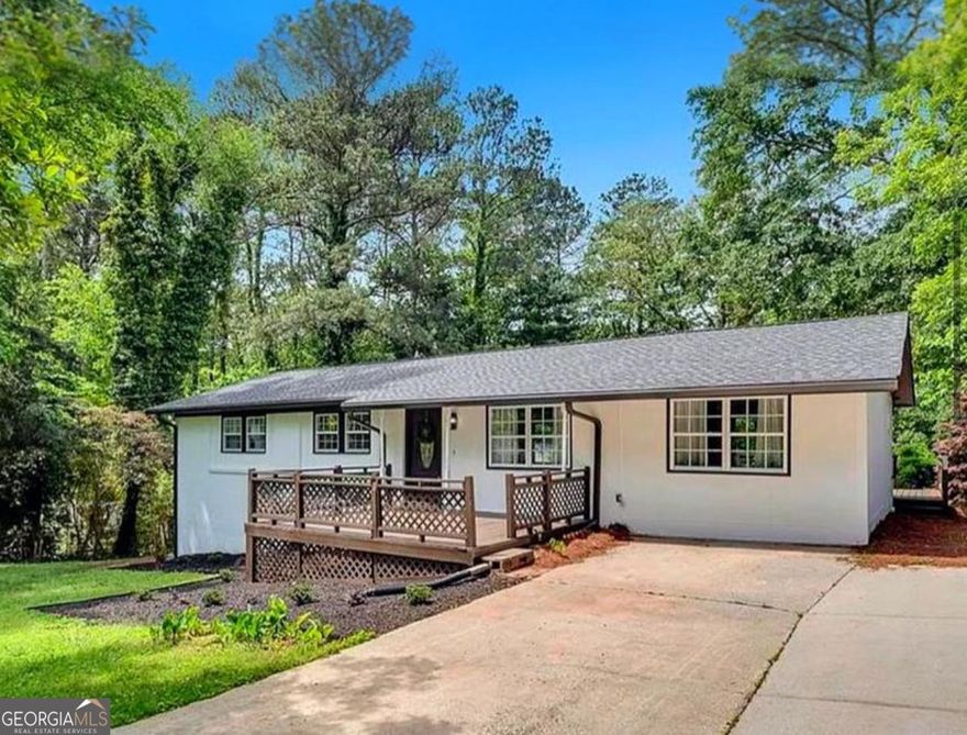 Looking for a home that checks every box, style, location, and smart updates? Beautifully renovated 4BR/2BA ranch in the heart of Marietta! This move-in ready home sits on a spacious, fenced lot with both front and backyard, perfect for relaxing, entertaining, or play. Enjoy an open-concept layout with natural light, brand-new flooring, and fresh interior/exterior paint.  The kitchen boasts quartz countertops, new stainless steel appliances, a breakfast bar, and views to the living room. The primary suite features two closets, a double vanity, and a tiled, spa-inspired shower. Step outside to your private deck or take advantage of the electric-powered shed, ideal for a workshop, studio, or extra storage.  Minutes from Marietta Square, I-75, parks, schools, and shopping. A rare blend of style, updates, and location. Do not miss this Cobb County gem!  Hablamos espanol. Pregunta por financiamiento
