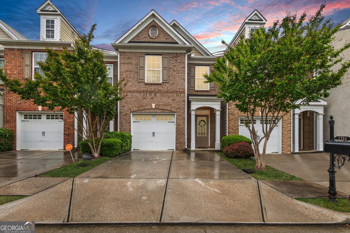This move-in ready 3-bedroom, 2.5-bath townhome in a prime Lawrenceville location offers the perfect blend of convenience and tranquility-just 5-10 minutes from I-85, Hwy 316, Starbucks, grocery stores, and more. The main level features durable LVP flooring, a cozy fireplace in the living room, and an open-concept layout that flows seamlessly into the dining area and kitchen. You'll love the crisp white cabinets, granite countertops, and modern touches throughout, including fresh paint and updated light fixtures in the bathrooms. Upstairs, the spacious owner's suite includes double sinks, a separate soaking tub and shower, and a large walk-in closet. Two additional bedrooms share a full hallway bath, and the laundry room is conveniently located nearby - Schedule your showing today!