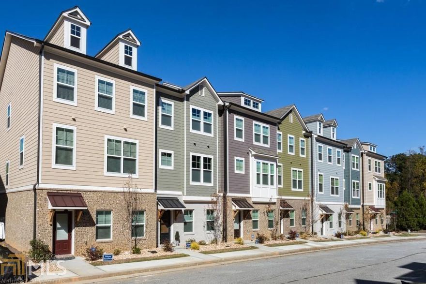This spacious new town home features a very open floor plan with gourmet kitchen and large center island. The Farnworth plan offers a spacious dining room for large gatherings. Lots of bells and whistles including 5 inch hardwood floors and 4 inch crown molding. This particular unit features additional upgrades such as fireplace ledge stone, kitchen back splash and upgraded kitchen counter tops. Large bedroom and full bath on the terrace level could be an office/bonus room. Easy commute to downtown Atlanta, Smyrna and the Cobb Galleria area.