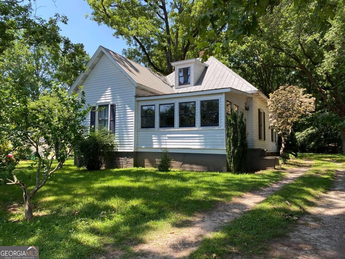 Charming historic cottage located in the heart of Old Town Lilburn. This stunning home features a spacious bedroom and full bathroom on the main level, charming kitchen with plenty of cabinet space, and living room with two decorative fireplaces. Upstairs is the second bedroom or office/workshop. Unique opportunity to live in a gorgeous historic home within steps of everything Old Town Lilburn has to offer! Grab a bite to eat at nearby restaurants, or take a walk on the greenway trail just down the street. Located in the award-winning Parkview school district and close to major highways. Washer/dryer and yard maintenance are included.