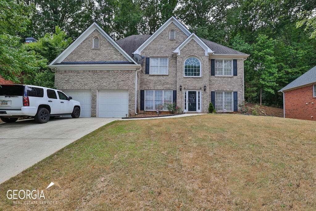 Welcome to the Summit at Huncrest! This stunning executive home boasts 5 bedrooms and 4 baths, offering ample space for your family's needs. As you step inside, you'll be greeted. by a grand 2-story foyer and a separate living room and dining room that provide ideal spaces for formal gatherings and entertaining guests. The heart of the home is in the spacious family room, complete with a cozy fireplace and an abundance of windows that flood the space with natural light. The attractive master suite is a true sanctuary with a master bath featuring a double vanity and his/her closets and a garden tub, perfect for relaxing after a long day. The Summit at Huntcrest is known for its great neighborhood feel. Imagine strolling along the sidewalks, enjoying the well-maintained surroundings, and engaging with neighbors. It's a community that offers both tranquility and a sense of belonging. Don't miss thIs rare opportunity to make this home your own. Schedule a showing today and start envisioning your life in this Lawrenceville gem. Top rated schools and walking distance to shopping.