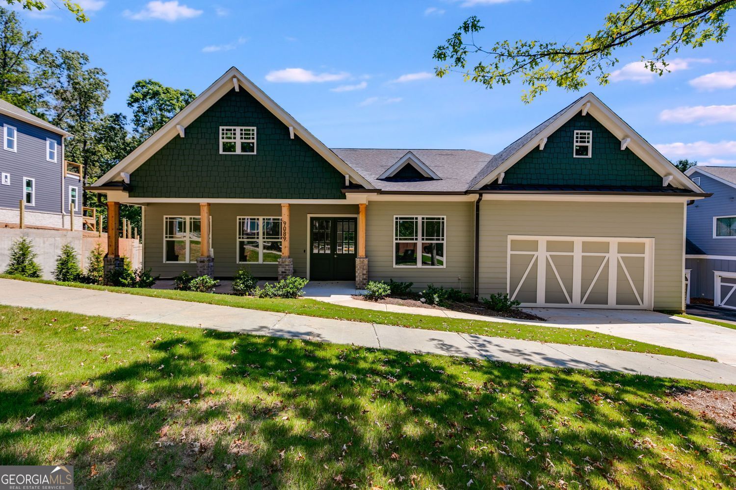 Seller and preferred lender are contributing to buy down your rate to 4.99%! Plus, this home includes a 2-10 builder warranty for added peace of mind. Even better - homes of this quality are typically priced at least $20 more per square foot, making this an incredible value. Seller also has 6 additional lots available in Tributary at New Manchester, 4 of which have not started construction yet and 5 homes under construction in Tributary at The Villages. Step into elegance in this modern craftsman ranch. Through the double wood doors, the foyer opens into a tile foyer with soaring 10-foot ceilings throughout, 8-foot doors, and wide plank wood floors. Enjoy 8-foot tall cabinets in the chef's kitchen, a massive 5 foot by 10 foot oversized quartz island with sink, beverage cooler, stainless vent hood, pendant lighting, tile backsplash, and butler's pantry. Every oversized bedroom offers its own spa-style ensuite with quartz counters, tiled showers with frameless glass doors and linear drains, floor-to-ceiling tile with niches, and anti-fog vanity mirrors. The owner's suite adds a freestanding soaking tub and an oversized walk in closet. Highlights include an 5-foot wide electric fireplace, tiled laundry with sink, unfinished basement plumbed for 2 future baths with finished stairway from the main floor, LED lighting, and a private rear deck. Located on a .38-acre lot near Lions Gate in Douglasville, Living in the Tributary subdivision, you'll have sidewalks, tennis courts, playground, pool and Clubhouse with easy access to golf, shopping, hiking, mountain biking and all of this with just a short commute to Atlanta. Luxury, value, and future potential - all in one.