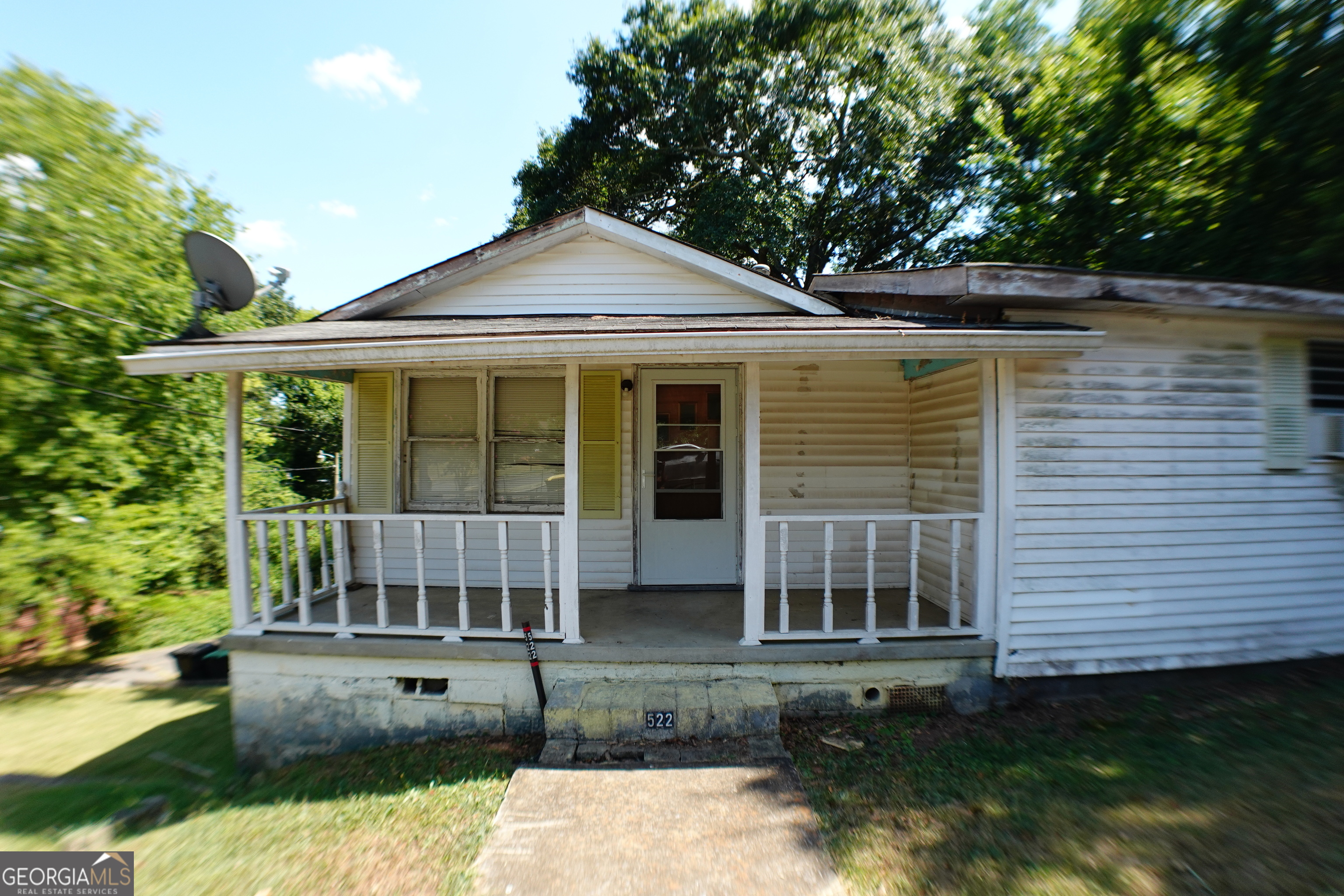 This two-bedroom, one-bath home sits on TWO deeded parcels totaling 11,326 sq ft, offering excellent potential for renovation, expansion, or investment. The property features a basement foundation and a carport located on the second parcel, providing added flexibility and value. Inside, you're greeted by a comfortable family room that flows seamlessly into the dining area and kitchen. The kitchen offers direct access to the back patio with stairs access to the basement. Down the hall, you'll find a linen closet, the first bedroom, and the generously sized primary suite, which includes two closets. The full bathroom is spacious and functional. Conveniently located near downtown Rome, schools, and shopping, this home's solid construction and prime lot size make it an ideal choice for buyers seeking a project with lasting value.