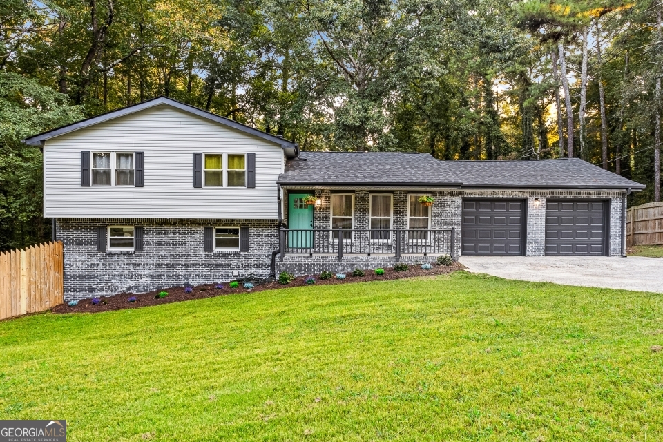 Have you ever imagined having a resort in your own backyard? At 8267 Freestone in Jonesboro, GA, that dream becomes reality! This beautifully renovated home offers modern updates, comfort, and style both inside and out. Step inside to discover a bright and inviting space with newly installed front windows, fresh interior and exterior paint, and new flooring throughout. The home is enhanced with all new recessed lighting, ceiling fans, and stylish wall fixtures with an integrated fireplace for cozy evenings. The upgraded kitchen features new appliances with a hood range and an elegant lighting package, perfect for the home chef. The basement has been transformed with a new bedroom and a full bathroom, ideal for guests, in-laws, or flexible living space. Bathrooms across the home have been remodeled with new vanities and toilets, while the furnace has been serviced and paired with a new thermostat and new water heater for efficiency and peace of mind. Outside is your personal retreat: a brand-new deck, repaired and renovated gazebo with walkway, and a cleaned and serviced pool nestled in an oversized yard with a park-like setting. It's truly all the win-wins - relaxation, recreation, and entertainment in one. Additional updates include a new roof, new automatic garage doors with motors, and newly installed interior and exterior doors throughout. Every detail has been thoughtfully updated, making this home move-in ready and unlike anything else on the market. Don't miss your chance to own this one-of-a-kind property in a serene Jonesboro setting!