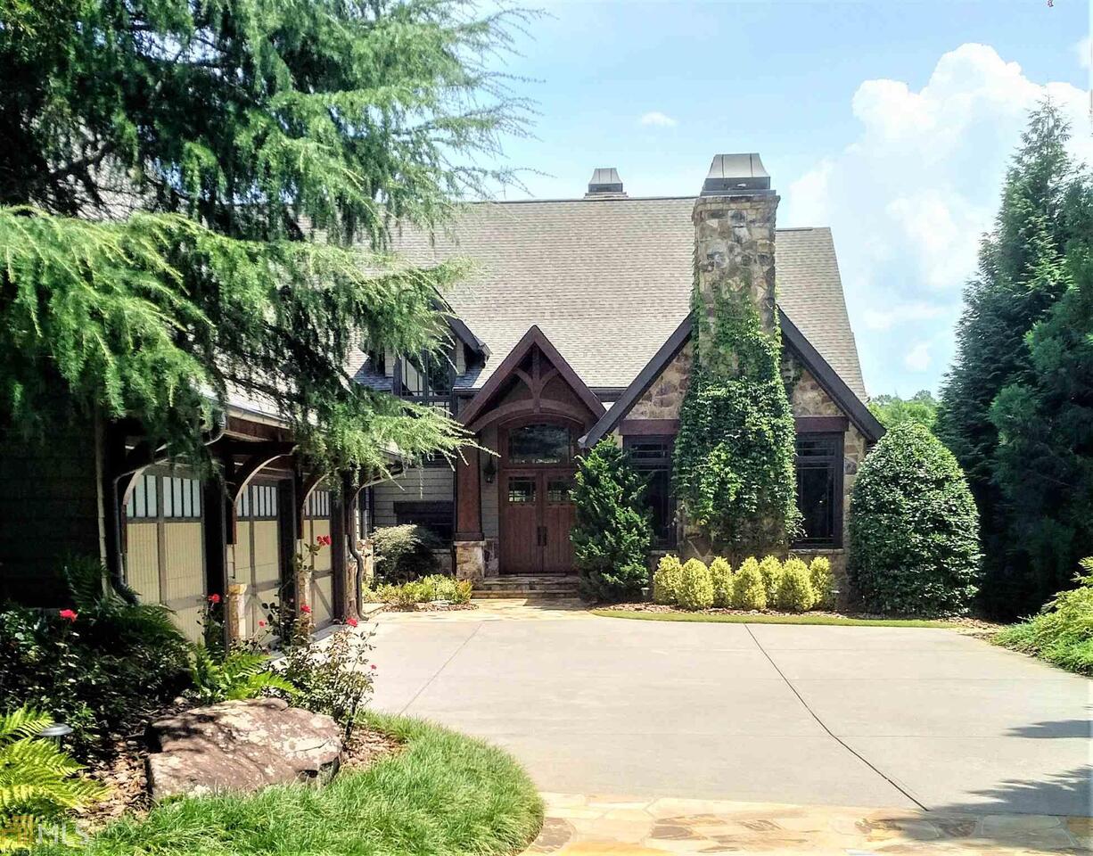 Exquisite Craftsman style home on Lake Chatuge! This luxury estate is being sold with an additional buildable lake-front lot. Property ownership below the contour included and nearly 300 ft of shoreline. Prestigious address in the most sought after location on Lake Chatuge. Very private, yet minutes to town. Home is fully furnished and meticulously maintained. Elevator, new roof, new whole house generator, surge protection, HVAC humidification and filtration, water purification and softening systems, camera security system, home theater, library, and billiards room. Main level and downstairs kitchens with Wolf, Subzero, and Asko appliances. Outdoor fireplace and firepit to enjoy chilly evenings by the lake! Very gentle slope from home to water. Deep water dbl. slip covered dock w/2 boat lifts and 2 kayak ports. More pix to come!