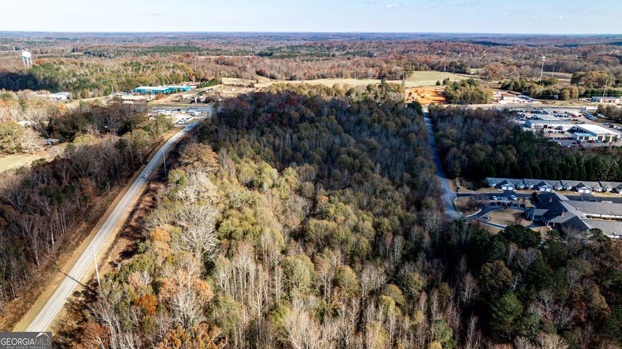 Discover 20.5 acres of versatile, wooded land offering exceptional road frontage on both US Hwy 441 and Steve Reynolds Industrial Pkwy. Located just inside Jackson County, this prime property is strategically positioned one mile east of I-85, ensuring seamless connectivity and accessibility. Zoned C2, this site is ideal for a variety of uses, including retail, office, or multi-family development. Its flexible zoning, combined with high visibility and proximity to major transportation corridors, makes it a unique opportunity for developers, investors, or businesses looking to capitalize on the area's growth. Don't miss this chance to develop a property with outstanding potential in one of Georgia's thriving commercial corridors.
