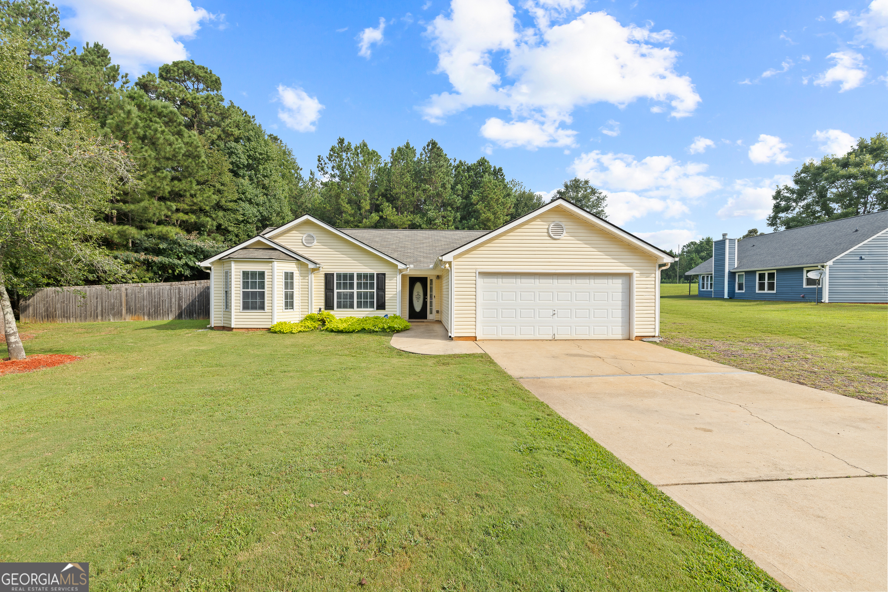 Beautifully Updated Ranch on Half an Acre in Covington! Welcome to this well-maintained 3-bedroom, 2-bath ranch on a spacious 0.5-acre lot. This move-in ready home features an open concept design, with a family room highlighted by vaulted ceilings and a cozy fireplace. The updated kitchen offers granite countertops, tile backsplash, plenty of cabinets, and new flooring throughout. The large laundry room adds convenience. While the master suite boasts a trey ceiling, walk-in closet, and spa-like bath with double vanities, a garden tub, and separate shower. Enjoy the outdoors with a fenced, landscaped yard, complete with a sprinkler system and stone accents. A 2-car garage and a roof that's only 2 years old provide peace of mind. Located at the front of the subdivision, this home offers easy access in and out. Don't miss your chance-this one won't last!