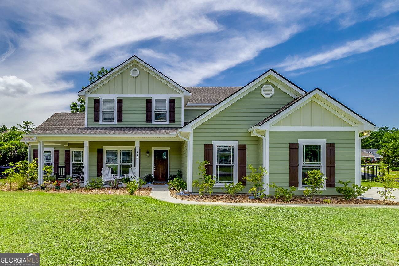 This stunning custom home has been so thoughtfully designed. It welcomes you with a traditional Southern front porch, offering a chance to slow down and enjoy the beauty of the oversized corner lot. Once inside, you'll notice the many architectural details like the coffered ceilings, stone fireplace that make this home stand out. The ground floor is designed for entertaining with a gourmet kitchen complete with double ovens, soft-close cabinets, and an enormous marble island at the back offering easy access to a formal dining area and a screened porch. The ground floor also features one of two master suites, with a huge walk-in closet and beautiful ensuite, as well as a fifth bedroom/bonus room built to accommodate a pool table with room to actually play. Upstairs, you'll find three more bedrooms, including another Master suite with two walk-in closets, a custom tile shower, and a large soaking tub. The home features LVP throughout, with no carpet. All for less than $700,000 in one of Savannah's most popular neighborhoods. Let's not forget the resort-style amenities. Gorgeous pool, many beautiful ponds, tennis courts, a gym, yoga room, even a movie theater.