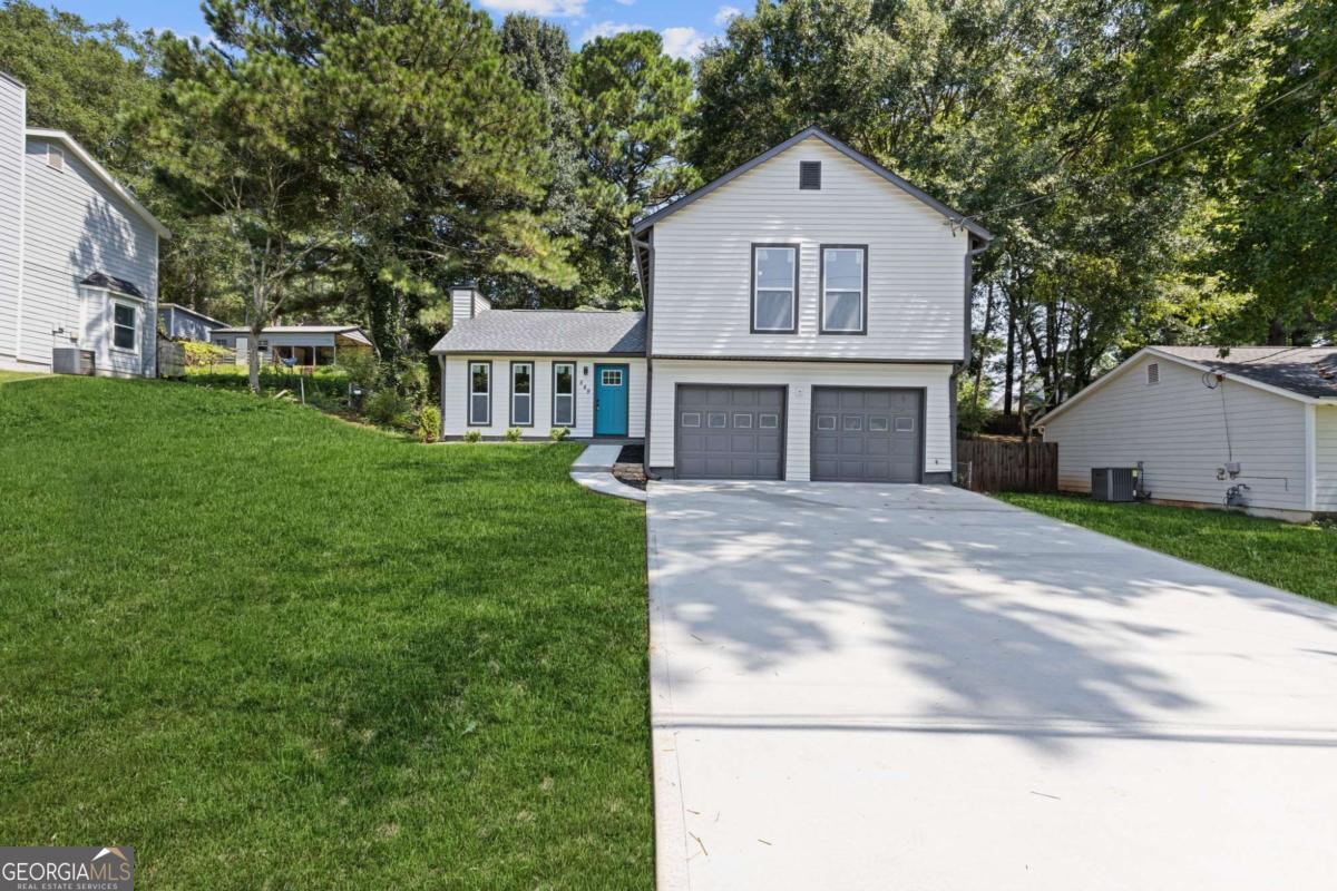MOVE-IN READY, FULLY RENOVATED & UPGRADED HOME IN SOUGHT-AFTER LILBURN! THIS 3 BED 2 BATH SPLIT-LEVEL HOME IS SITUATED IN A QUIET, ESTABLISHED NEIGHBORHOOD. FEATURING A NEW ROOF, NEW WATER HEATER, NEW DRIVEWAY, NEW DOORS & WINDOWS, NEW LVP FLOORING, AND FRESH INTERIOR & EXTERIOR PAINT. THE FULLY RENOVATED KITCHEN BOASTS QUARTZ COUNTERTOPS AND BRAND NEW STAINLESS STEEL APPLIANCES. BOTH BATHROOMS HAVE BEEN BEAUTIFULLY UPGRADED WITH NEW VANITIES, SINKS, LIGHT FIXTURES, AND MORE. NO HOA! NO RENTAL RESTRICTIONS! PERFECT FOR FIRST-TIME HOMEBUYERS OR INVESTORS. CONVENIENTLY LOCATED JUST MINUTES FROM I-85, SCHOOLS, SHOPPING, AND DINING. DON'T MISS THIS TURNKEY GEM IN A PRIME LOCATION - SCHEDULE YOUR SHOWING TODAY!