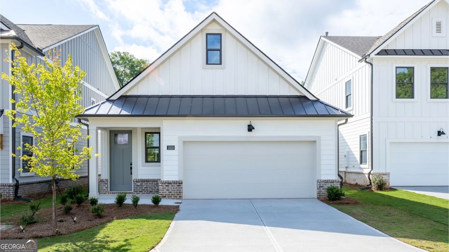 This captivating 1.5 story Bowen floorplan is nestled in the highly sought-after East Cobb area. Be one of the first homeowners in this prestigious community! Incredible open floor plan with the kitchen overlooking the dining and family room perfect for entertaining. The Bowen plan features a chef inspired gourmet kitchen w/ a island, Stainless steel appliance, quartz countertops and appliance package that includes an oversized cooktop, wall oven, wall microwave, custom wood hood complete with Revwood flooring throughout the main living spaces. Bedroom one and bedroom two are conveniently located on the main. Off the family room you will find a rear covered patio for outdoor living and front entry two-car garage. The upstairs features an additional bedroom and full bath with large walk in closet. This gated community features paver lined roads and amenities including pool, clubhouse and pocket park for residents' enjoyment. In addition to its tranquil and picturesque setting, homeowners will enjoy ease-of-access to Hwy 75 with, close proximity to shopping and eateries in Marietta as well as nearby trails and parks.