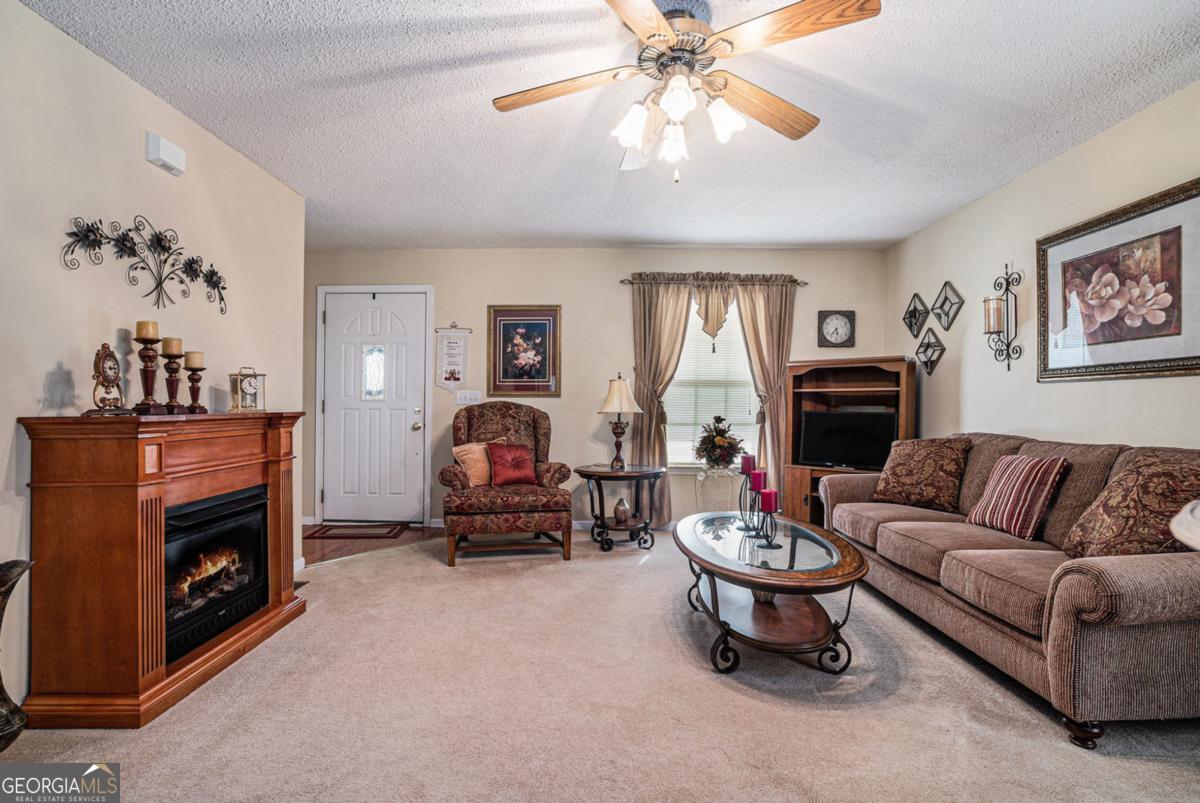 Welcome to this beautifully maintained Victorian-style home nestled in the desirable Victoria Station subdivision within the city limits of Lavonia. Enjoy your morning coffee or evening sunsets on the spacious front porch overlooking the friendly neighborhood. The newly refurbished back deck, accessible from both the garage and the sunroom, offers a private and peaceful space perfect for relaxing or entertaining guests. Inside, the kitchen features sleek stainless steel appliances, blending modern convenience with timeless charm. This home offers three comfortable bedrooms and two full bathrooms, making it a great fit for families, empty nesters, or anyone seeking easy living in a well-established community. Additional highlights include an outdoor storage building, providing ample space for tools, hobbies, or seasonal items. With convenient access to I-85 and only 25 minutes from beautiful Lake Hartwell, this home offers both comfort and location.