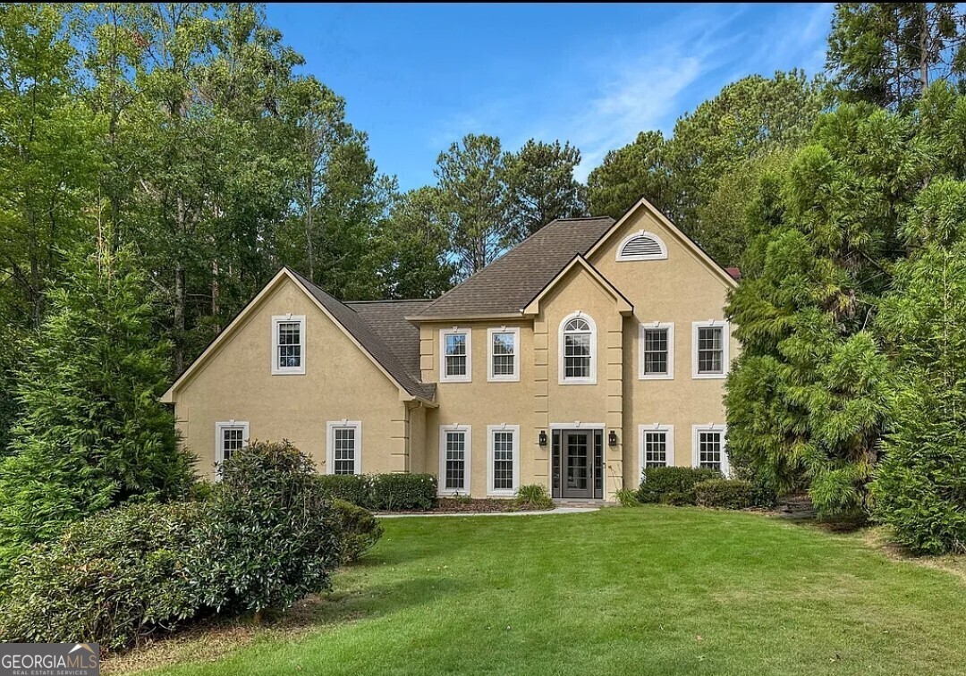 Welcome to 433 Blue Smoke Trail, a beautifully maintained 4-bedroom, 2.5-bathroom home nestled in the heart of Peachtree City. Offering an exceptional blend of modern updates and timeless charm, this home is perfect for those seeking both comfort and style. Step inside to discover the large kitchen; chef's dream, featuring granite countertops, ample cabinetry, and like-new appliances, making meal prep effortless. The updated master bathroom serves as a luxurious retreat, complete with modern finishes and thoughtful upgrades. A large loft area adds extra versatility-ideal for a home office, playroom, or media space. Outside, an unparalleled backyard sanctuary awaits. The fenced yard is home to a sparkling mineral water gunite pool, perfect for hot Georgia summers. Entertain guests in style with the fully equipped outdoor kitchen, or unwind by the outdoor fireplace for cozy evenings under the stars. A screened-in porch offers a peaceful space to enjoy your morning coffee while overlooking the lush backyard. For ultimate convenience, yard and pool service is included, ensuring the home's immaculate curb appeal is effortlessly maintained. Located in one of Peachtree City's most desirable areas, this home provides easy access to the city's renowned golf cart paths, parks, shopping, and top-rated schools. Don't miss the opportunity to make 433 Blue Smoke Trail your forever home-schedule a showing today!