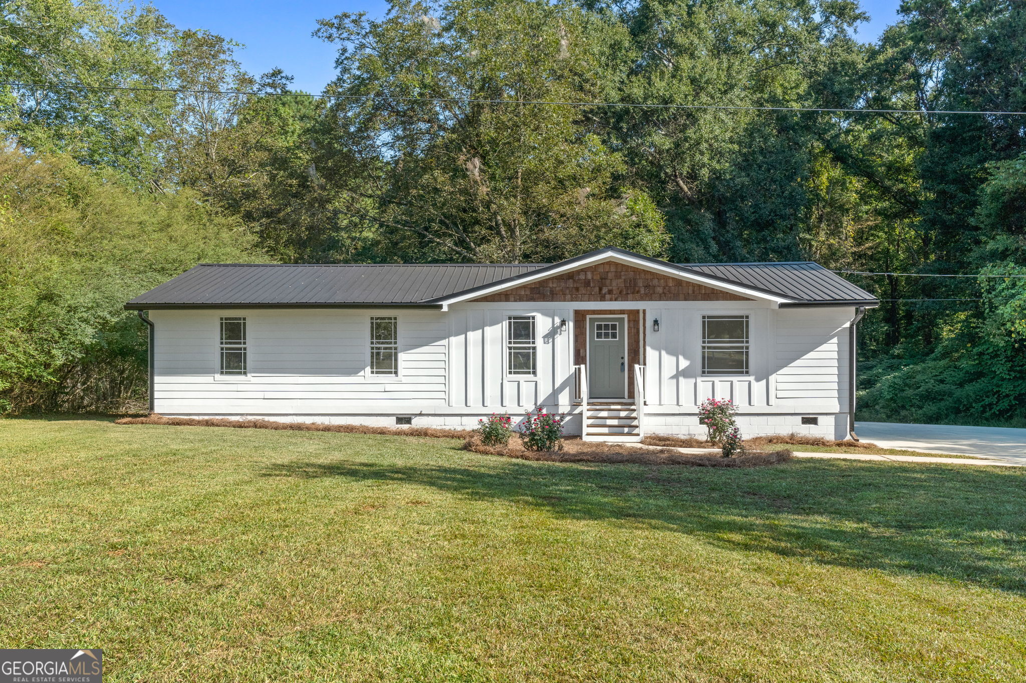 Welcome to 37 Johnston Rd! Charming and fully renovated, this 4 bedroom, 2 bath home sits on a spacious one-acre lot with a gated front entry. The freshly painted exterior is highlighted by a newly painted front door and a beautiful cedar shake accent that adds timeless curb appeal. Inside, you'll find all new flooring, modern light fixtures, and stylish hardware throughout. The kitchen shines with brand new cabinets, quartz countertops, and a sleek design perfect for everyday living and entertaining. Both bathrooms have been updated with new vanities, with the hall bath showcasing a stunning walk-in tile shower. Additional updates include a brand new HVAC system and durable metal roof, offering peace of mind for years to come. Outdoors, enjoy an expansive back deck overlooking a big backyard, complete with a storage building. This property offers the perfect blend of comfort, style, and functionality.