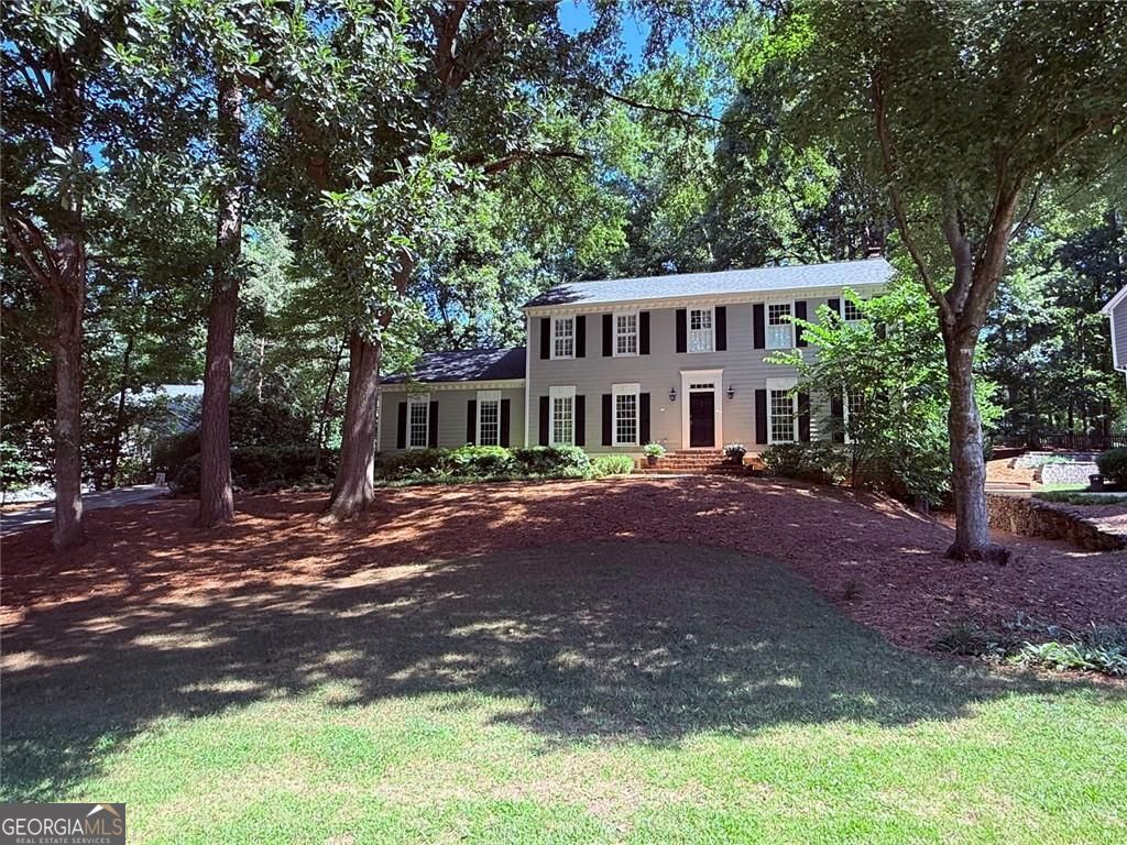 Welcome to 1160 Old Woodbine Rd, a beautiful two-story traditional home located in the sought-after neighborhood of Derby Hills. Fabulous curb appeal and priced below market. This light-filled home features a welcoming entry foyer and hardwood floors throughout the main level. The open kitchen features a coffered ceiling, granite counters, an island, and ample cabinet space. It includes a keeping room with views of the backyard and a new deck. The main level also includes a formal living room, a den with built-in shelving and a wood-burning masonry fireplace (recently rebuilt firebox), a separate dining room that seats 12+ for special occasions, and an elegant powder room. Completing the main level is a separate laundry room and a large side-entry two-car garage. Upstairs, you'll find a new hardwood landing and a large master suite with custom closet systems and a renovated master bath featuring double vanities and marble counters. There are three other generously sized secondary bedrooms and a full bath with granite counters, terrazzo tile, and an oversized jacuzzi. New carpet is installed throughout the upstairs. The fully finished terrace level, with both exterior and interior entry, boasts a full bath, a large bonus area with built-in shelving, a new ceiling, a pool table, and ample storage. Additionally, there is a surround sound system. The sweeping front yard offers lovely curb appeal, and the professionally landscaped grounds include a fenced backyard with a brand-new deck. The home has a new roof, and many of the systems have been recently replaced or updated. Conveniently located near top schools, parks, shopping, dining, and major hospitals, with easy access to GA-400 and I-285, this home is must-see.