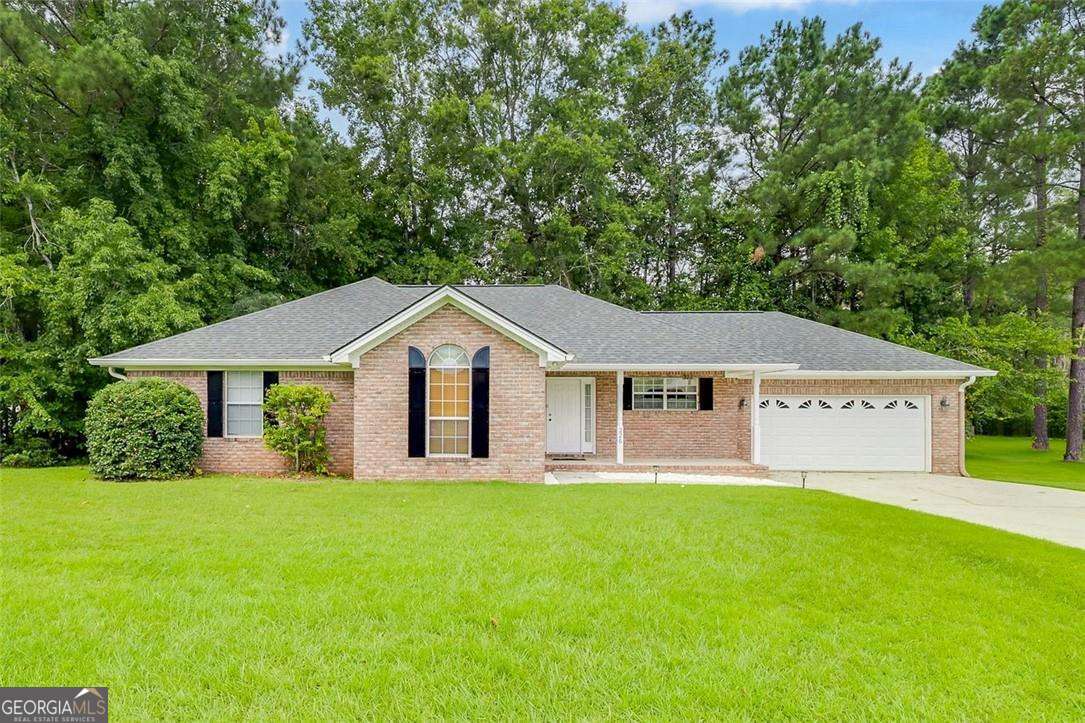 Discover this charming brick ranch on a large 2.39 acre lot in the heart of Rincon - with no HOA! This 3-bedroom, 2-bath home features an open floor plan with an abundance of custom woodwork, including beautiful ceilings, built-in bookshelves, and a cozy fireplace. The spacious kitchen and living areas make entertaining easy, and all appliances are included for your convenience. Enjoy outdoor living with a large yard perfect for activities, plus a deck offering a peaceful retreat for relaxing or hosting gatherings. This property combines both comfort and space in sought-after Effingham County