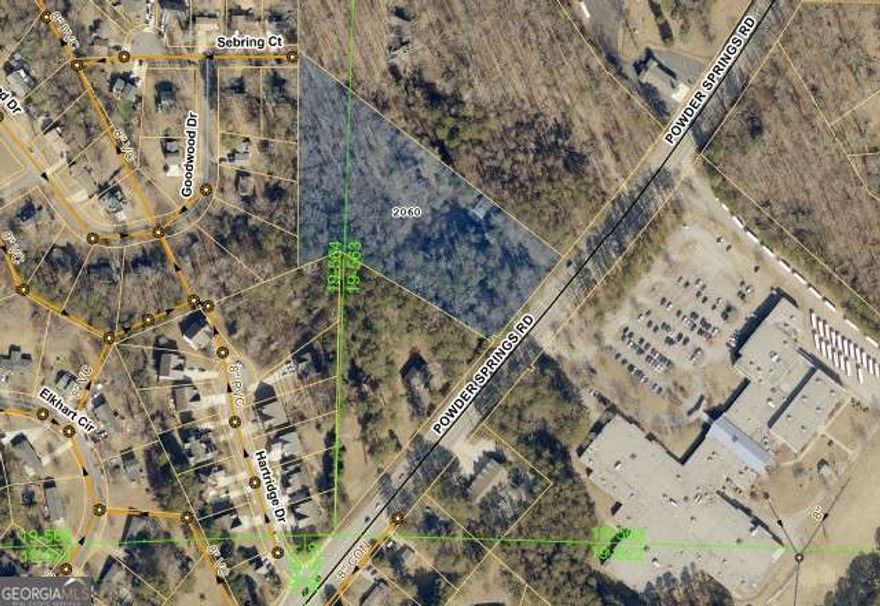 Calling all investors! This is your chance to secure a massive 4.5-acre opportunity in the heart of Marietta, GA - just minutes from Marietta Square, Six Flags, and White Water, and with easy access to I-75, GA-360, and GA-120, you're connected to everything. Located at 2060 Powder Springs Rd, this R-4 zoned parcel includes two existing houses that need some work, but with sewer connection and no floodplain restrictions this property offers strong development potential. Whether you're planning a full redevelopment, subdivision, or large-scale renovation, this land is packed with potential in a fast-growing Cobb County corridor. Don't miss this rare chance to build equity and unlock major returns in one of Metro Atlanta's hottest markets!
