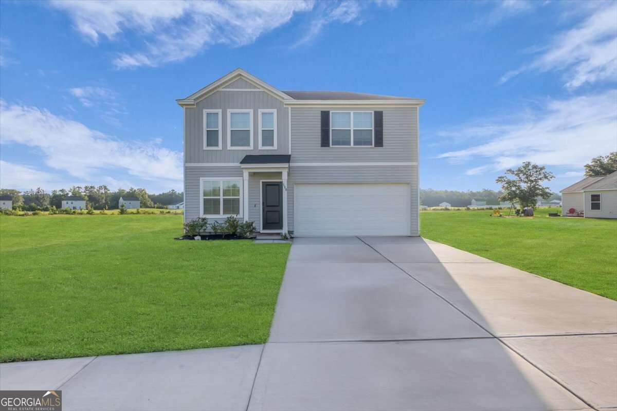 This beautifully maintained 4-bedroom, 2.5-bath home was built in 2022 and offers a modern open-concept layout perfect for both relaxing and entertaining. Enjoy seamless flow between the kitchen, living, and dining areas, all filled with natural light. Upstairs, you'll find all four bedrooms-including a spacious primary suite with a large walk-in closet, double vanity, linen closet, and private water closet. The laundry room is also upstairs, making everyday tasks a breeze. Outside, the large backyard backs up to a peaceful water view and features a cozy firepit-perfect for evening gatherings. With a 2-car garage and plenty of storage, this home checks all the right boxes. Conveniently located with easy access to Hinesville, Richmond Hill, and I-95, this home offers the space you need and the peace you'll love.